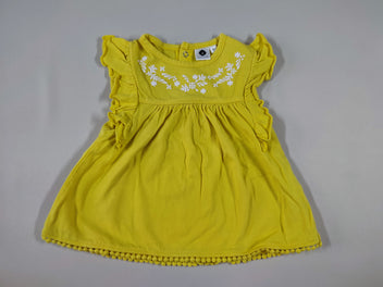 Robe m.c jaune motifs fleuris blancs sur le haut petits pompons sur le bord