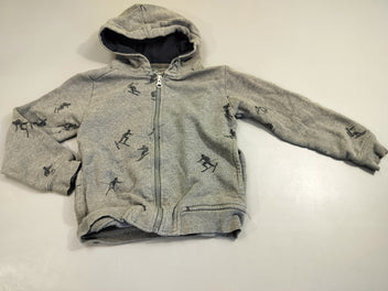 Gilet zippéà capuche ml gris chiné motifs skieurs 100% coton, légèrement bouloché. Pas de taille indiquée, estimée 3a