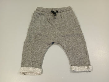 Pantalon molleton gris chiné à revers. Très légèrement bouloché