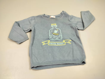 Pull bleu bâteau dans bouteille