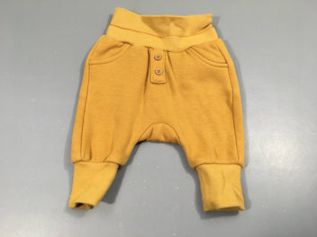 Pantalon molleton jaune, taille et chevilles élastiques . Intérieur chaud