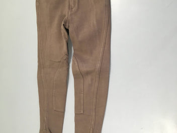 Pantalon d'équitation brun, légèrement bouloché