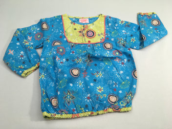 Blouse m.l bleue /jaune à motifs. Dessous élastique