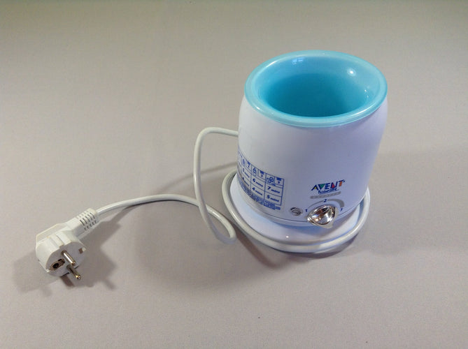 Chauffe biberon et petit pot naturally express, plastique arrière un peu fondu, moins cher chez Petit Kiwi
