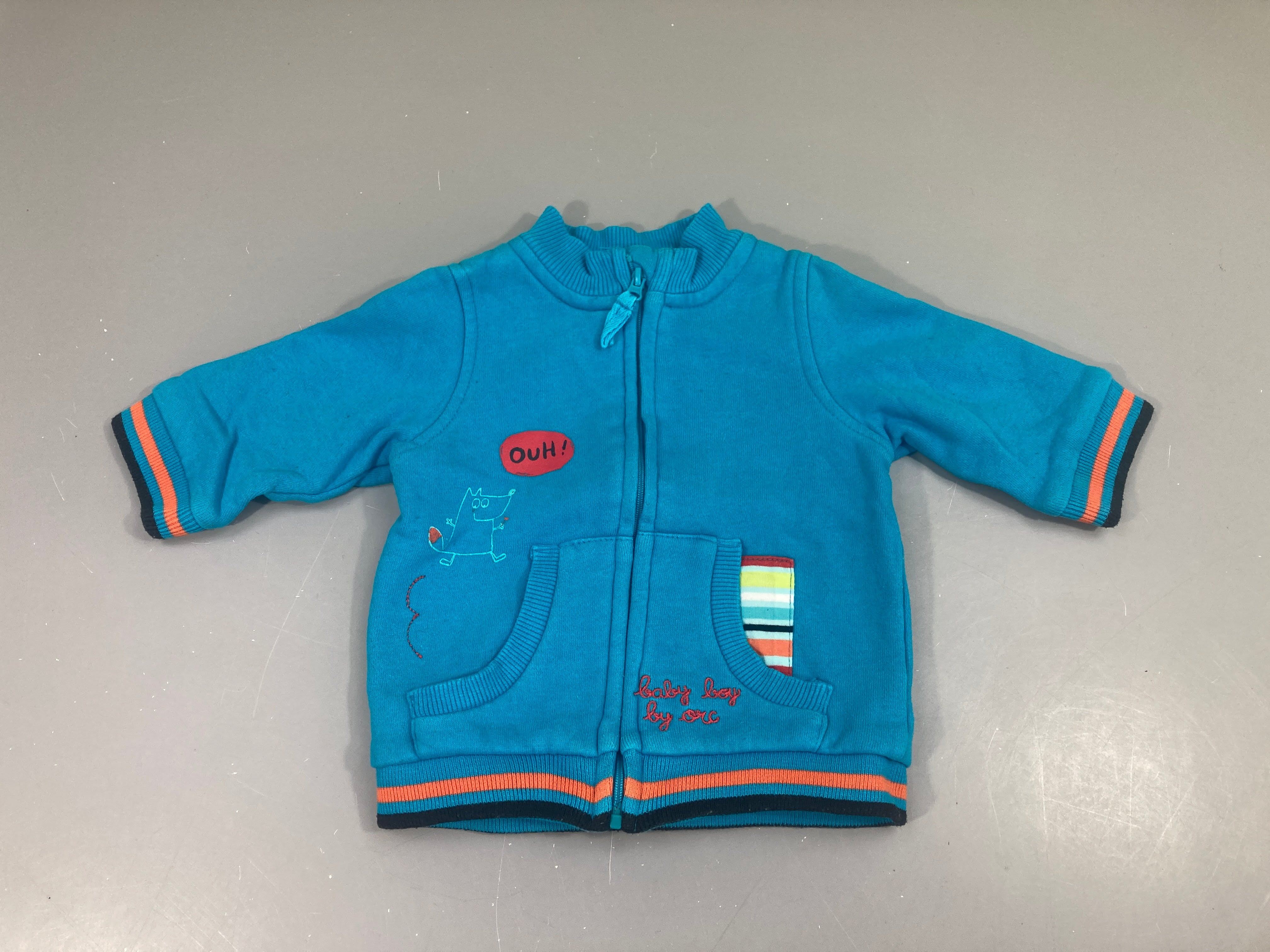 Sweat zippé bleu OUH! Légèrement décoloré coutures