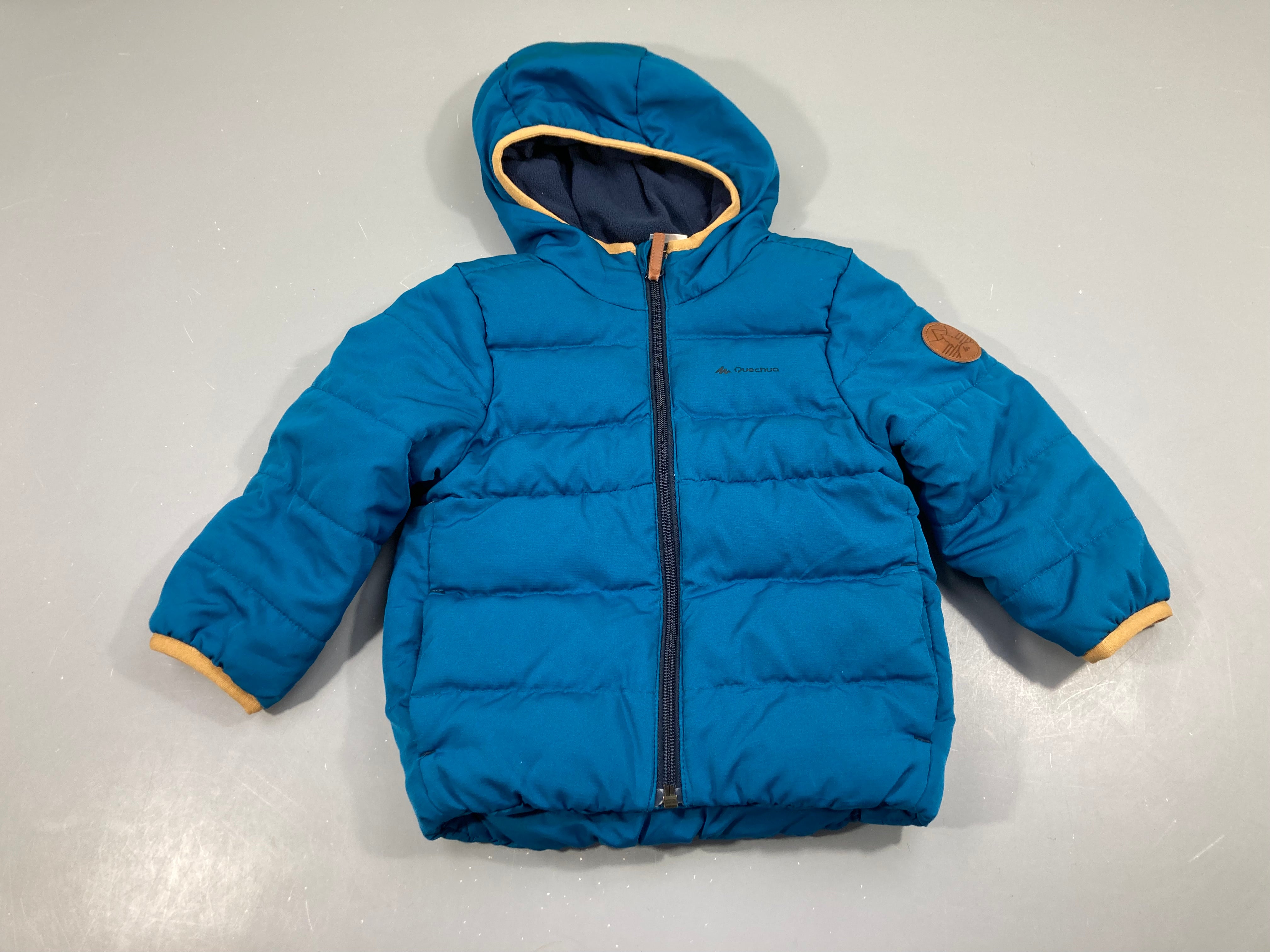 Doudoune light à capuche bleue Quechua