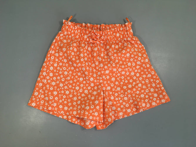 Short fluide texturé orange fleuri blanc, moins cher chez Petit Kiwi