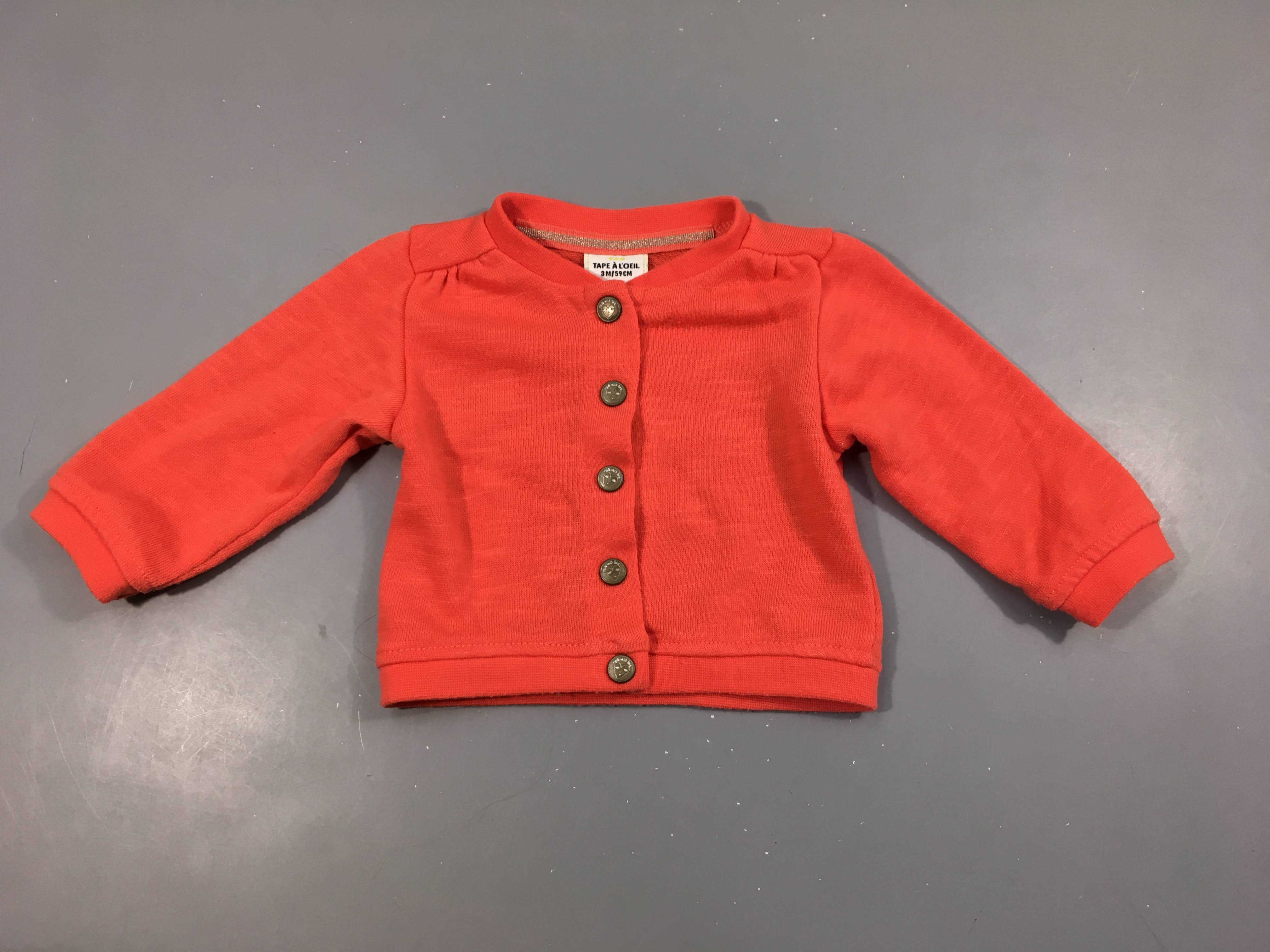 Gilet corail flammé, légèrement bouloché