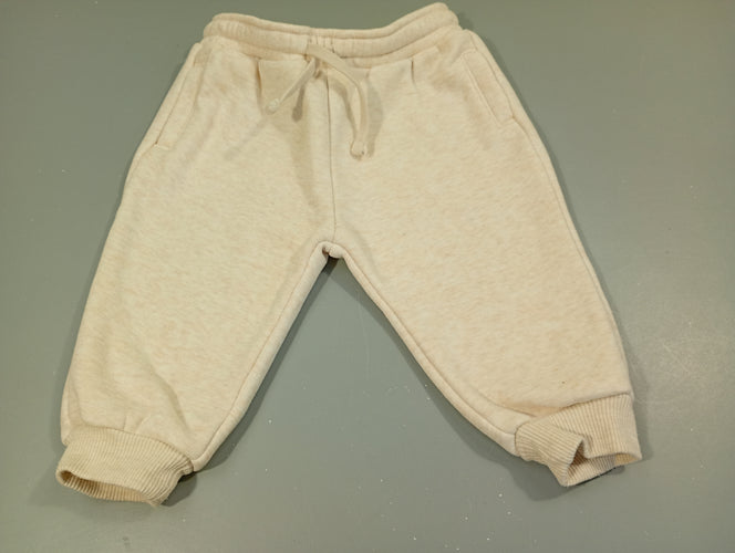 Pantalon molleton beige chiné , taille et chevilles élastiques. Légèrement bouloché, moins cher chez Petit Kiwi