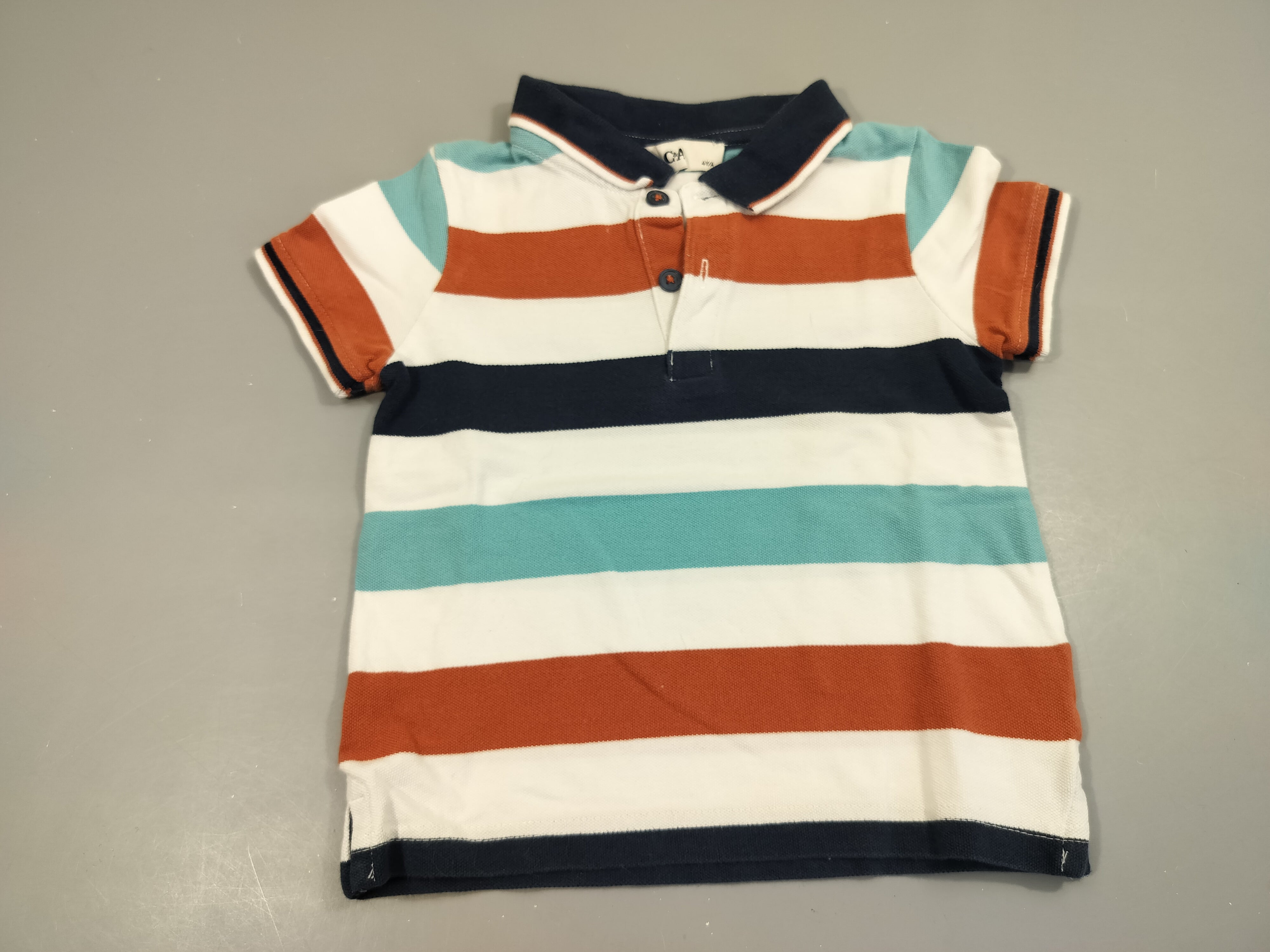 Polo m.c rayé bleu marine, blanc, bleu, orange 100% coton