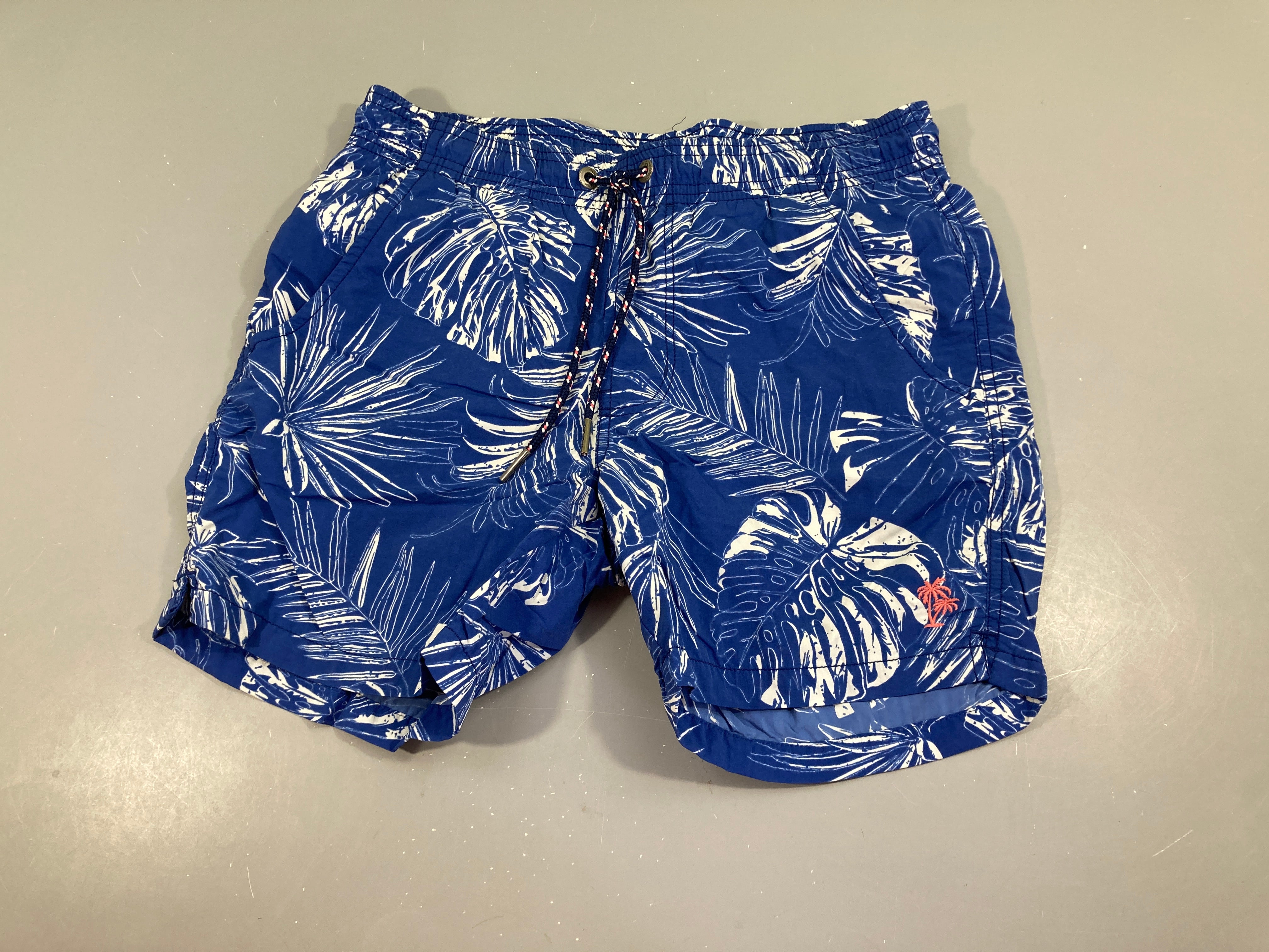Maillot short bleu feuillage blanc