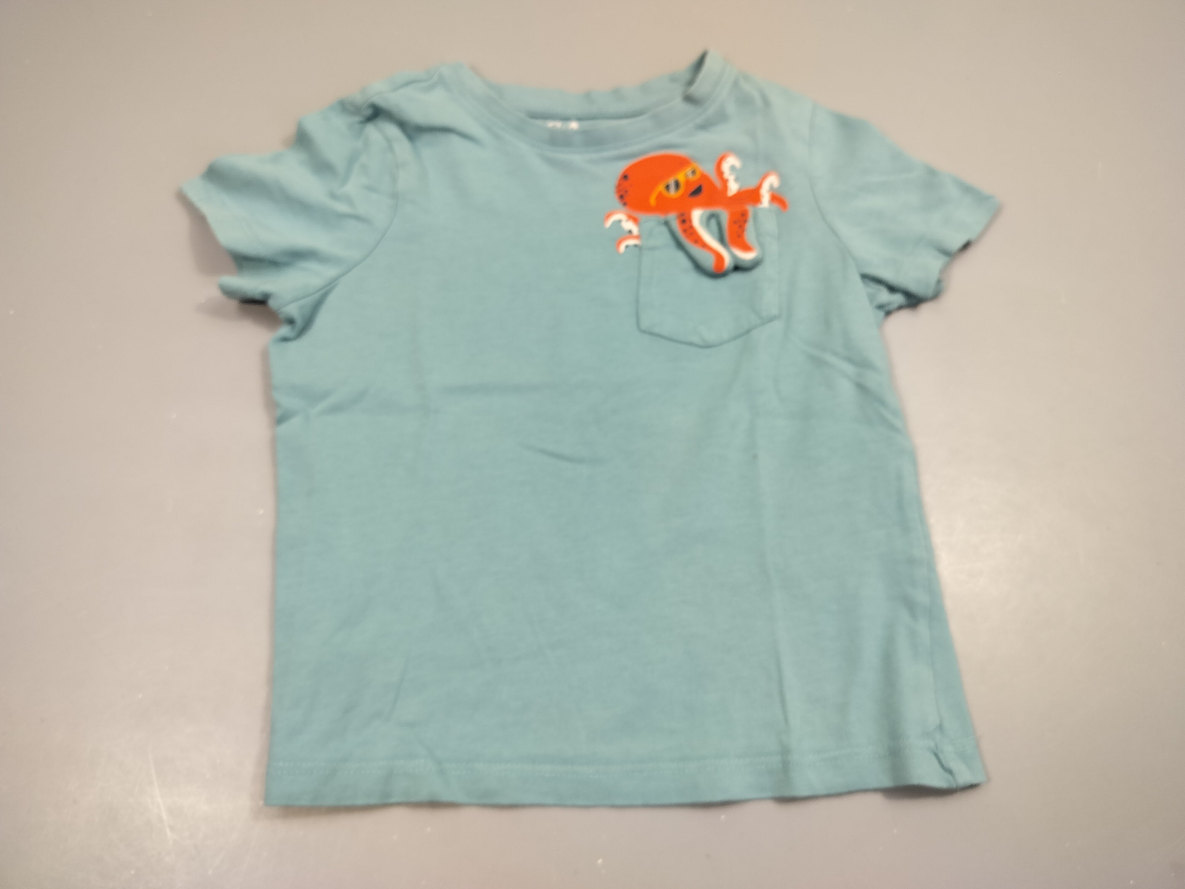 T-shirt m.c bleu, pieuvre orange 100% coton, petite tache