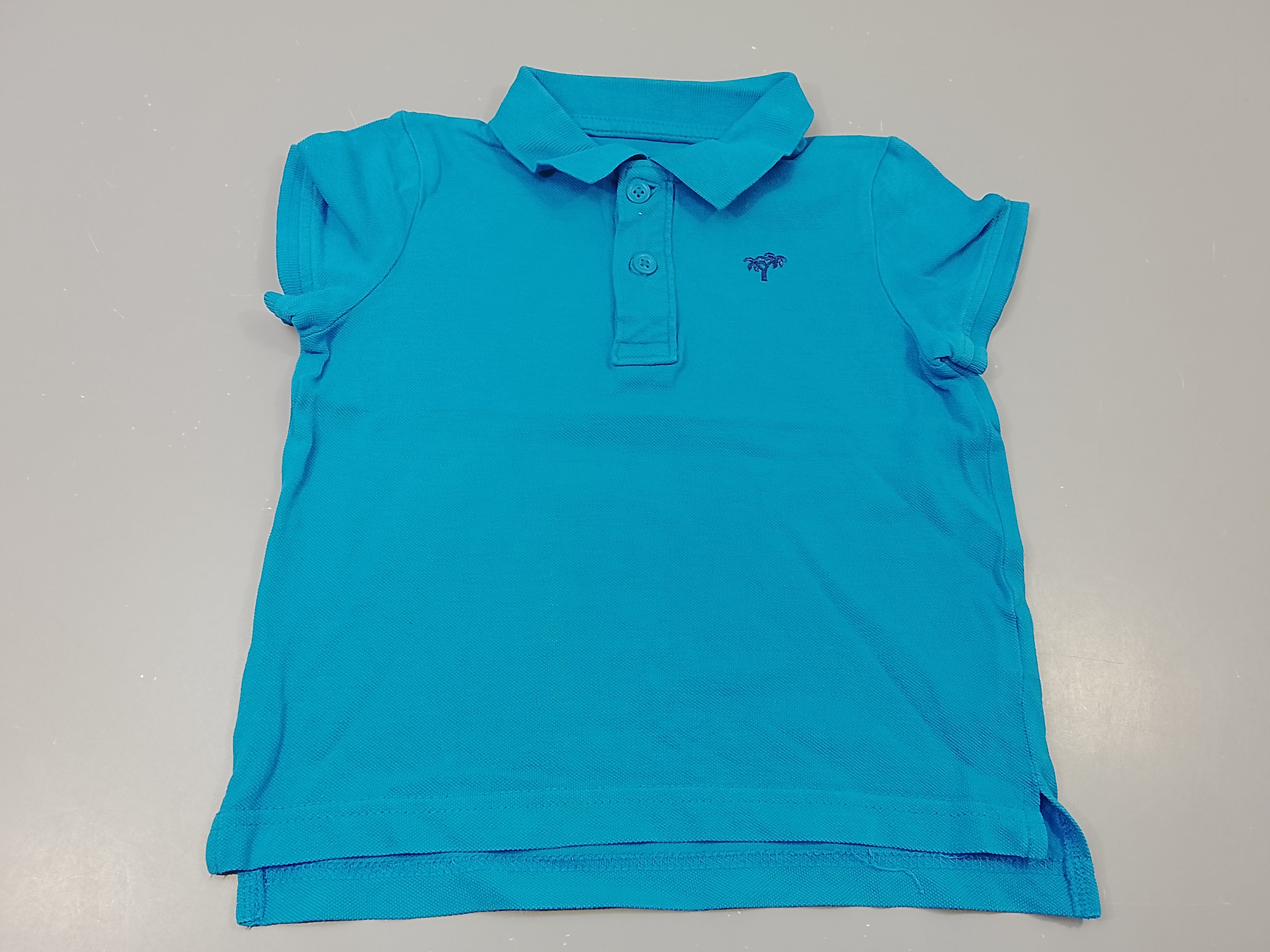 Polo m.c  bleu , petits palmiers