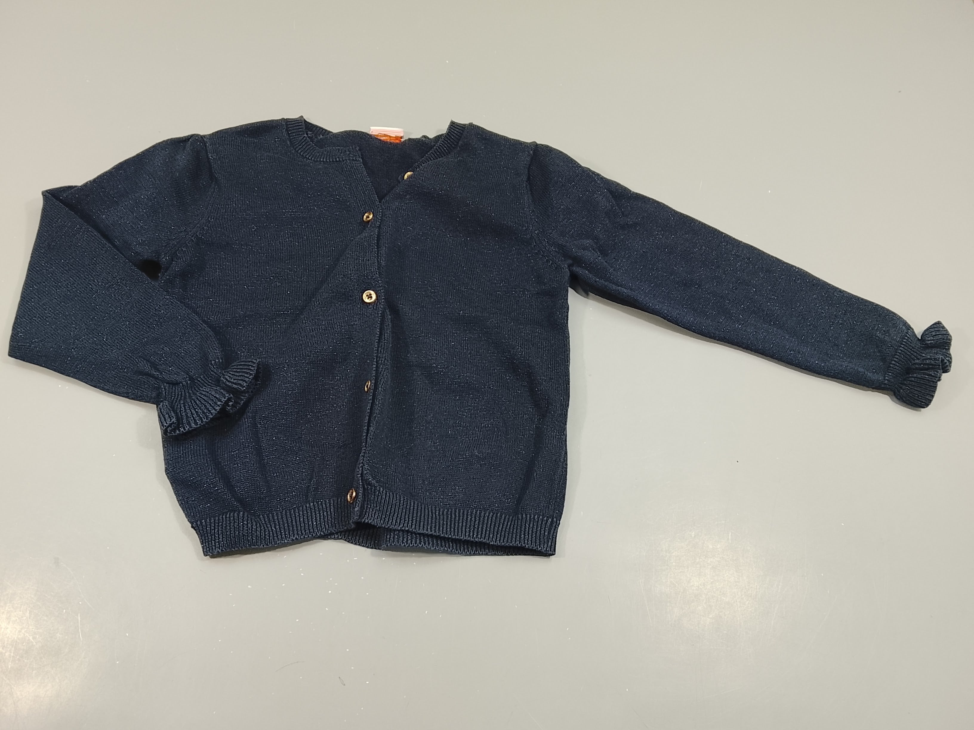 Gilet bleu marine, fines paillettes . froufrou aux manches