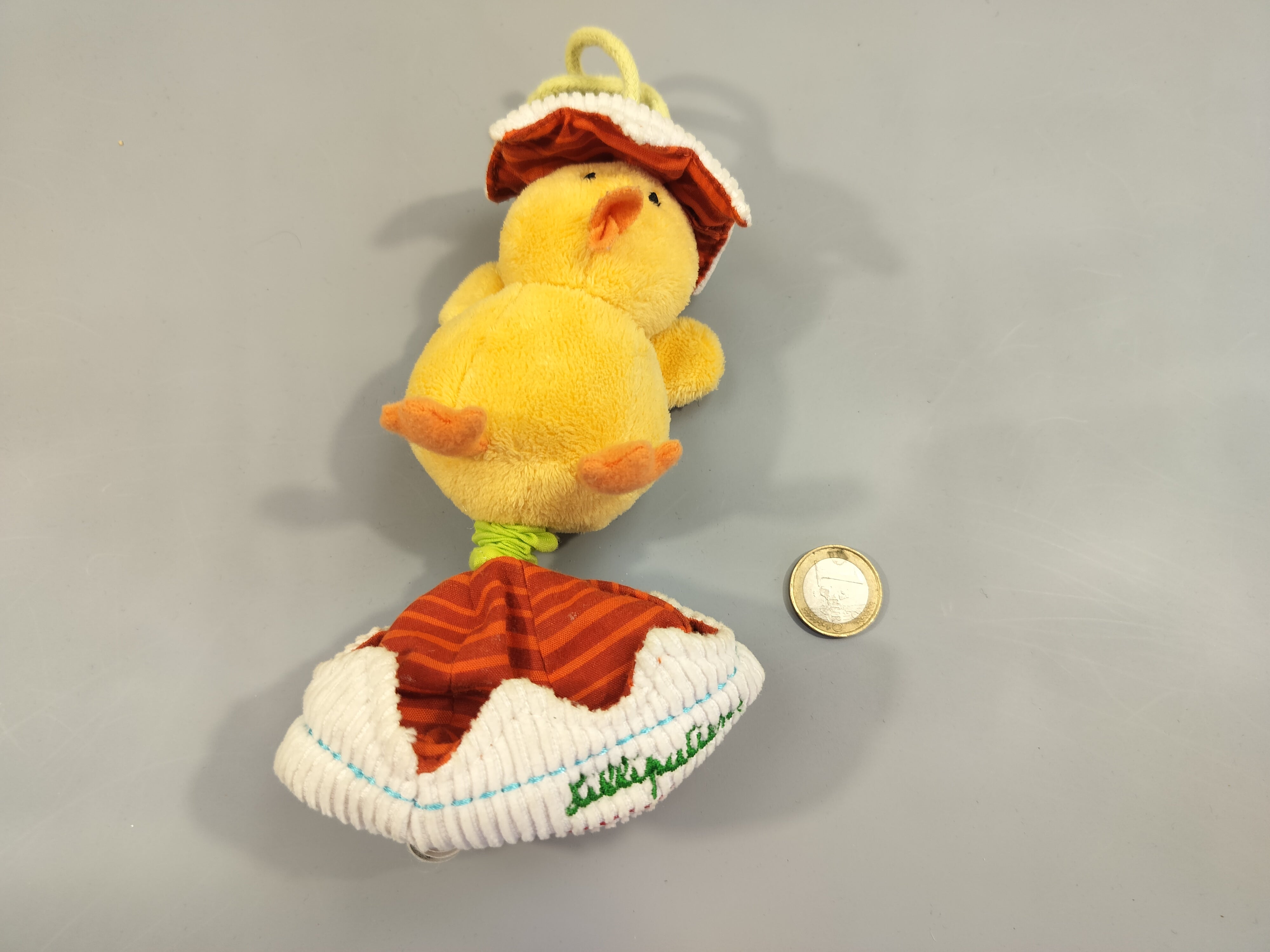 Peluche doudou vibrante  poussin, coquille d'oeuf