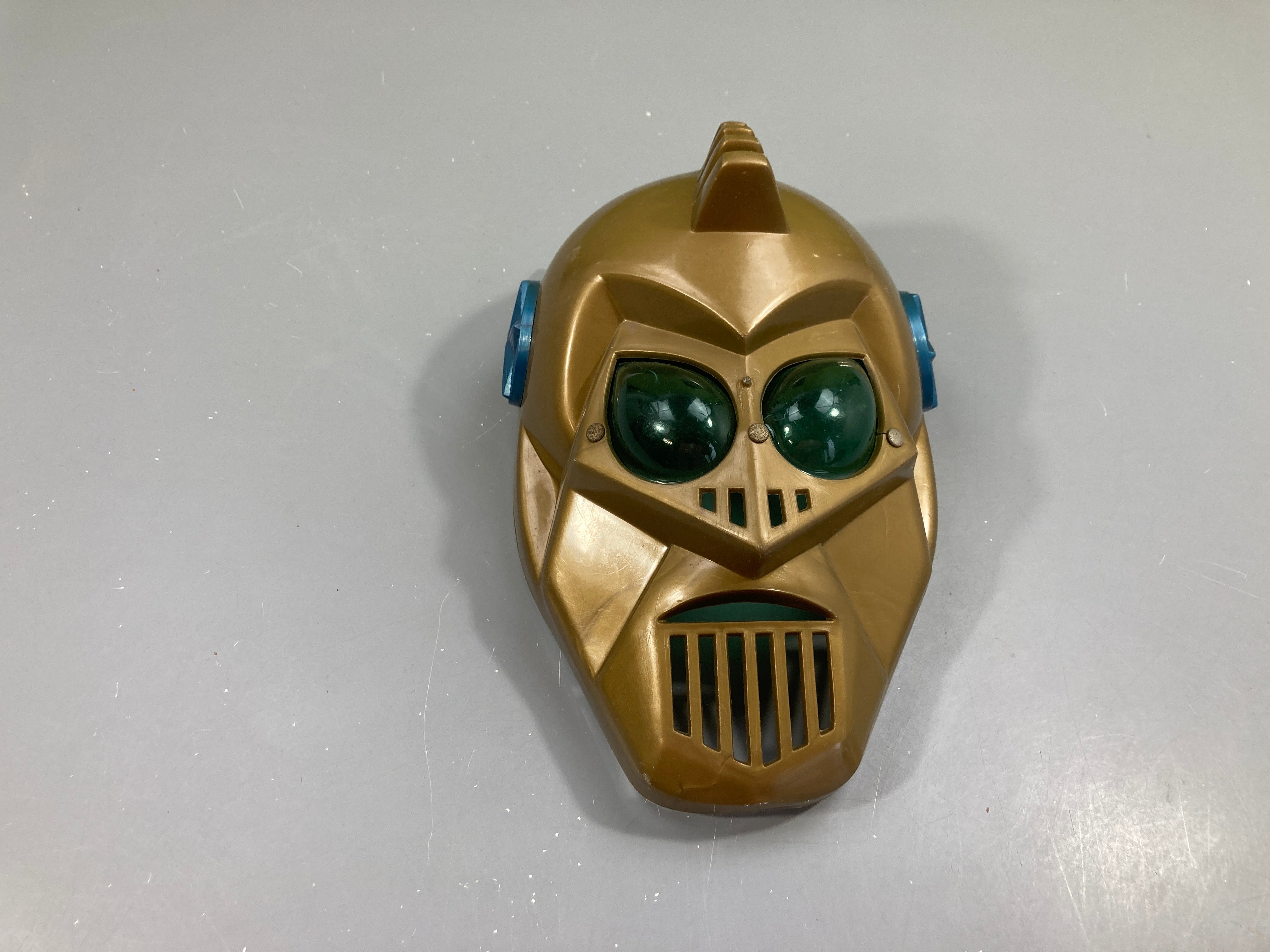 Masque robot doré, SideralBrek, Brekar, année 70