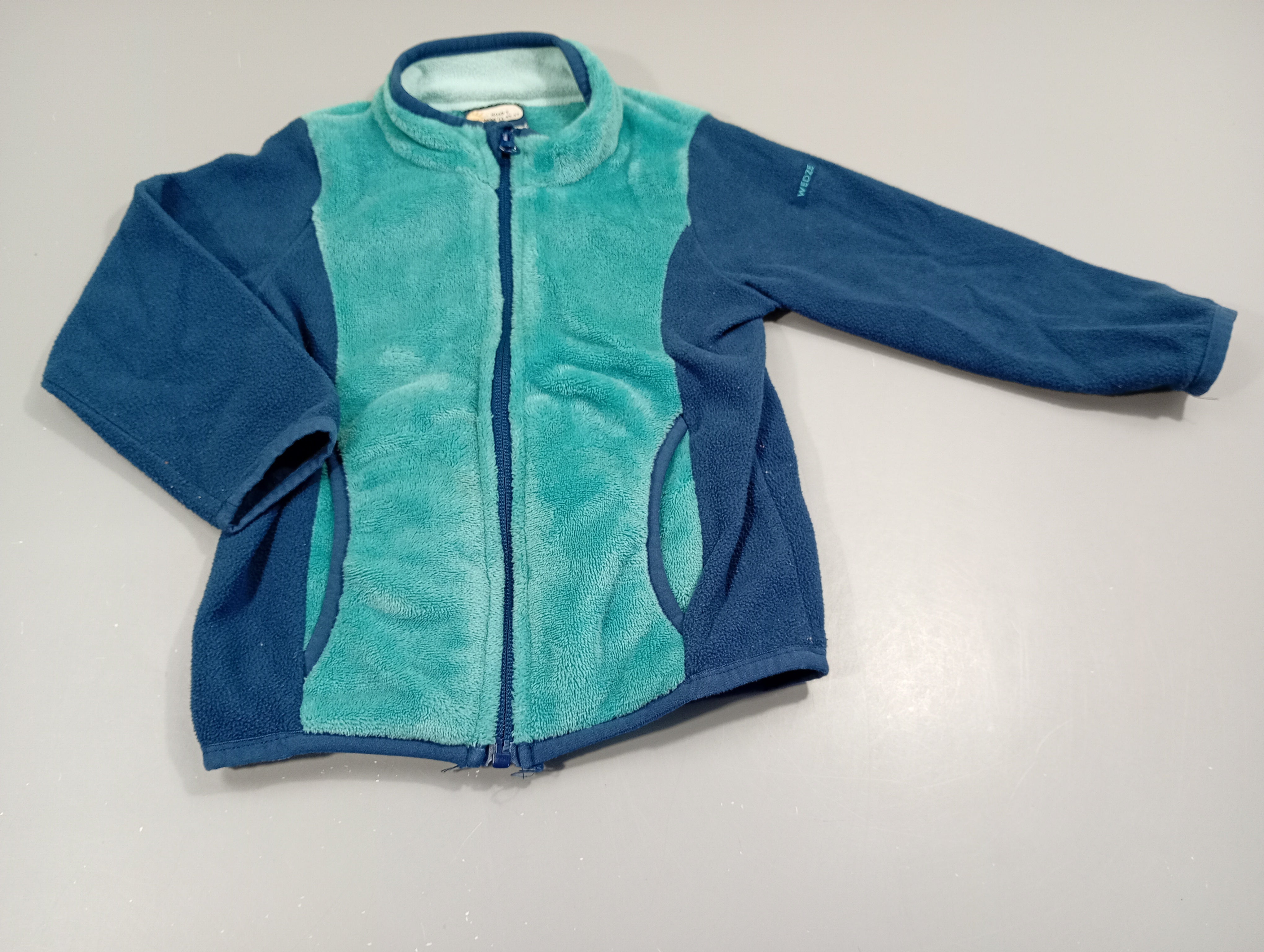 Gilet zippé turquoise et bleu marine bi-matière polar et duveteux