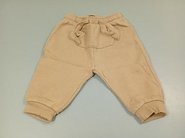 Pantalon molleton beige, taille et chevilles élastiques, moins cher chez Petit Kiwi