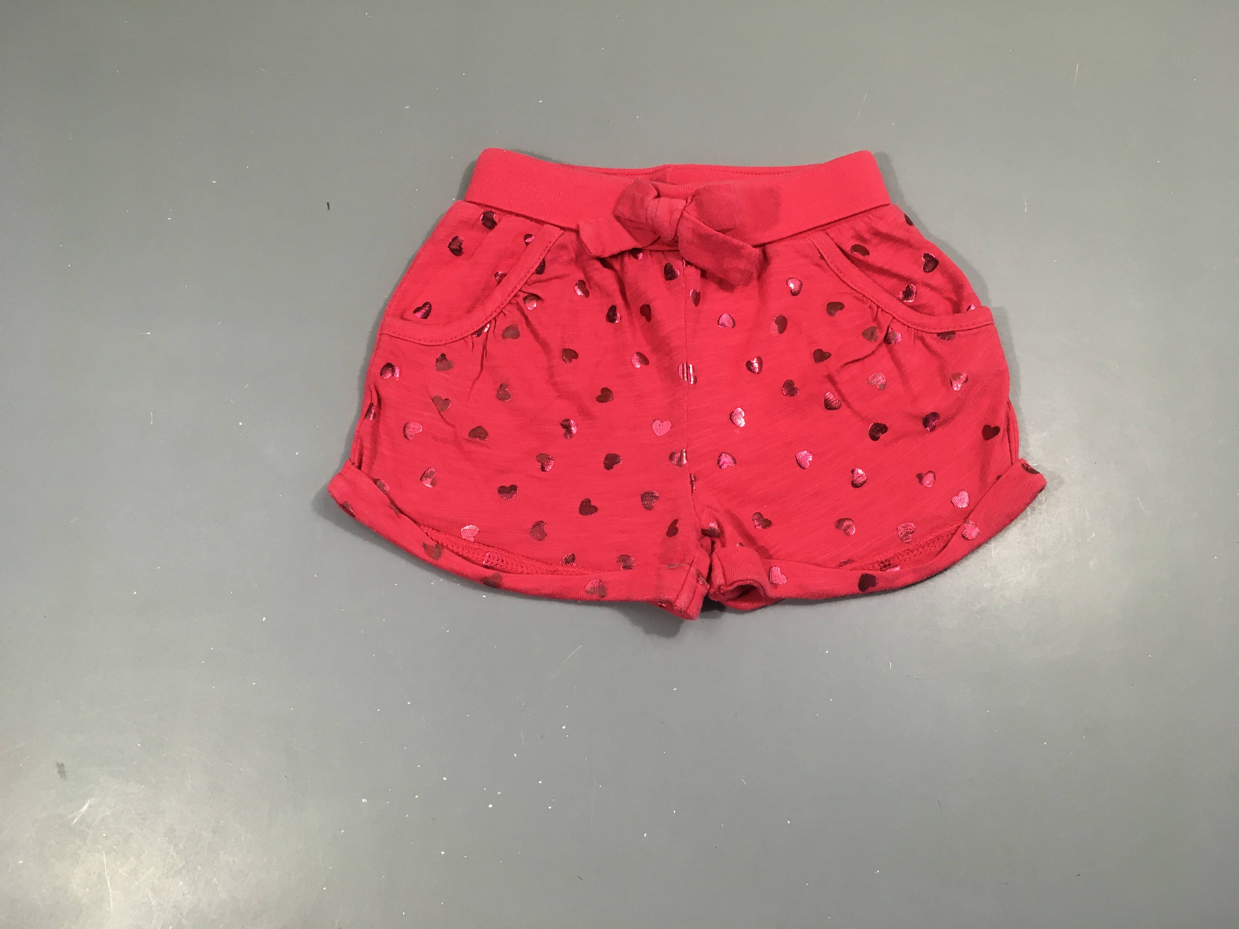 Short jersey rose flammé coeurs, noeud, très légèrement bouloché
