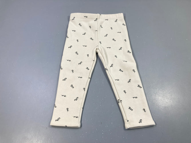 Pantalon molleton beige  motifs fleurs noires. Intérieur doux et chaud. Légèrement bouloché, moins cher chez Petit Kiwi