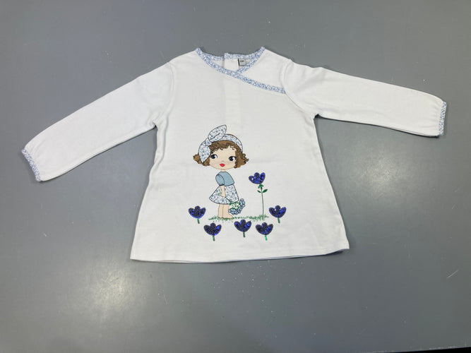 T-shirt m.l blanc, motif fillette , fleurs en sequins bleu marine. Légèrement bouloché, moins cher chez Petit Kiwi