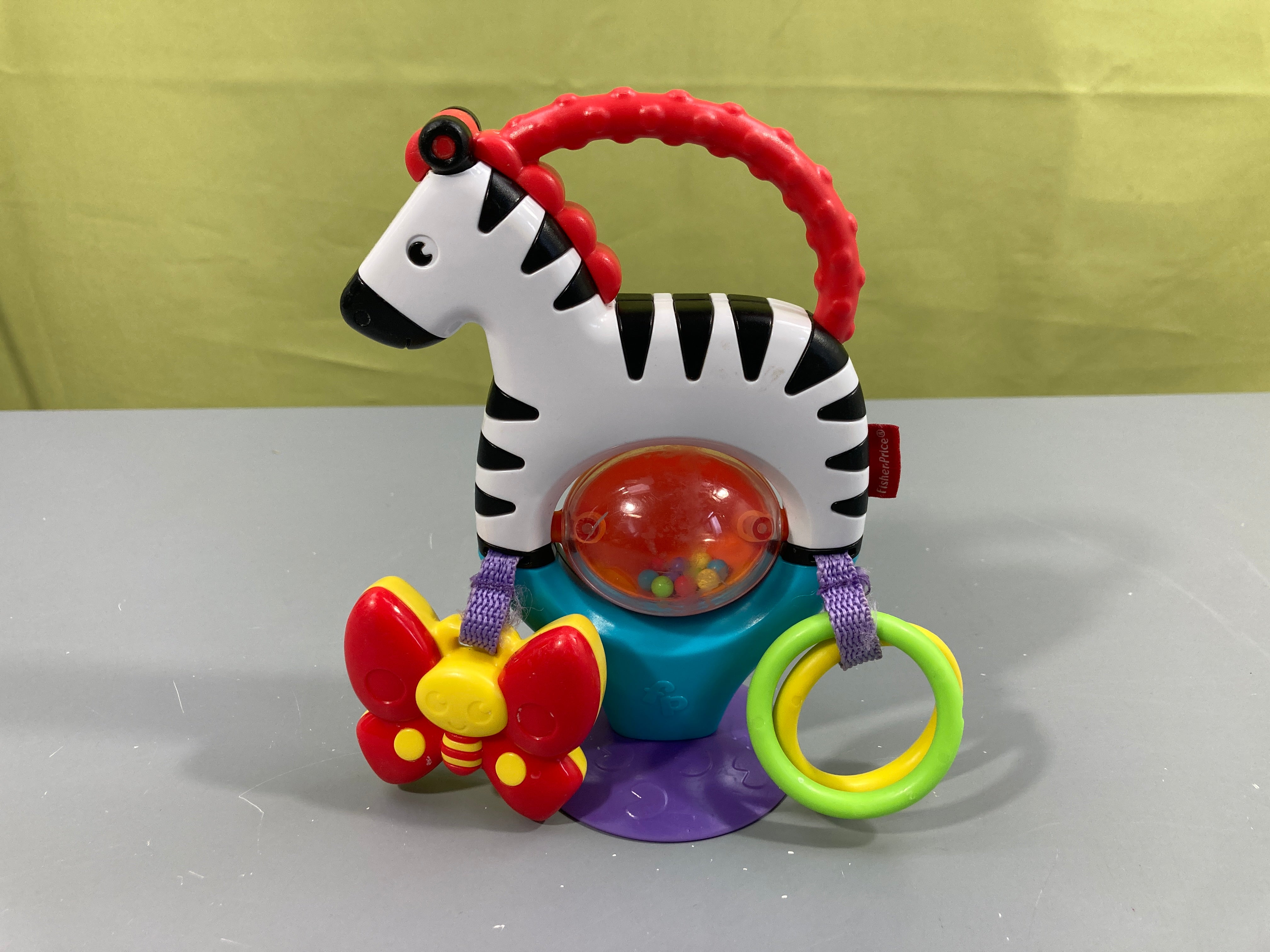 Jeu zèbre à ventouse multi activités (hochet, anneaux,..)