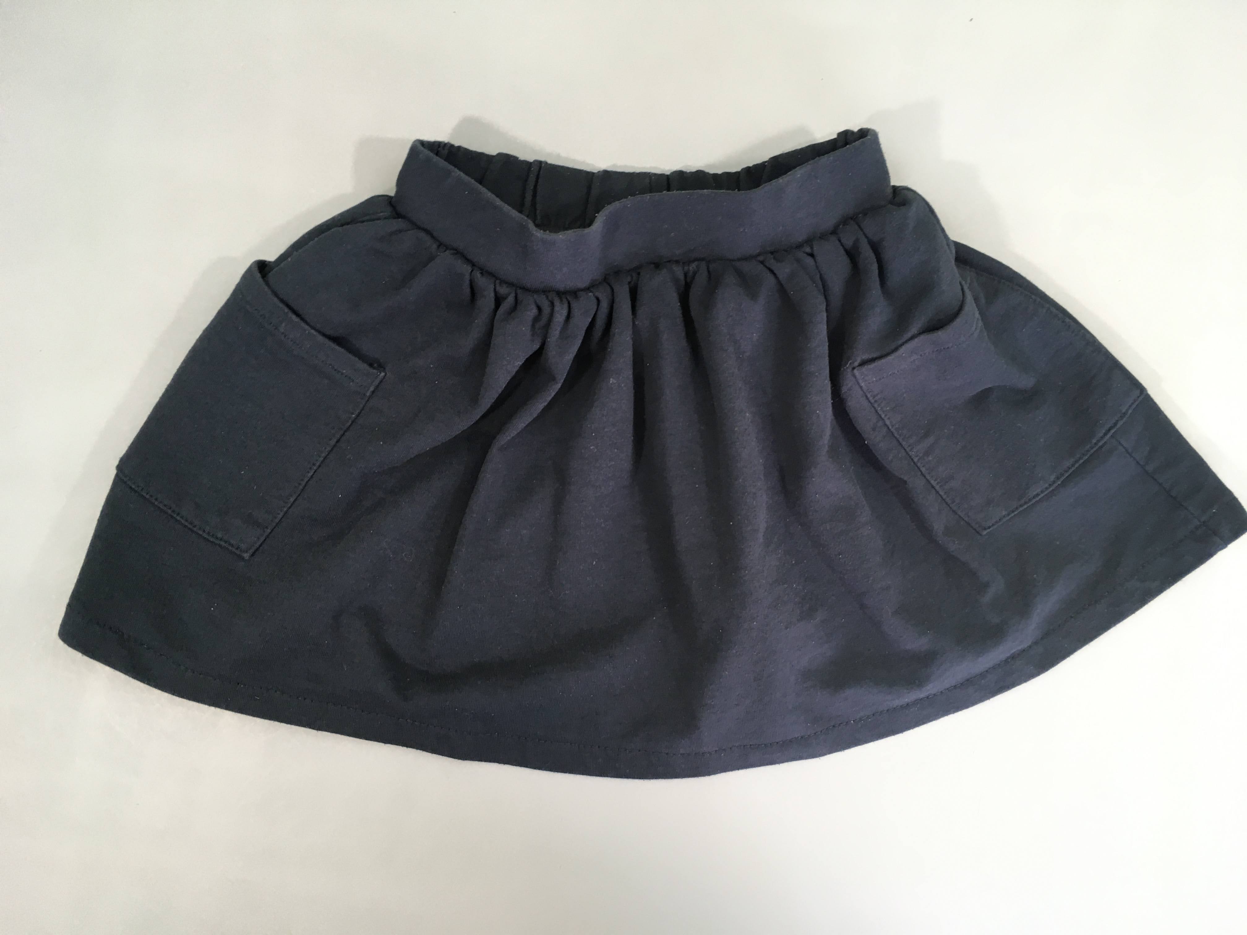 Jupe jersey bleu foncé poches, légèrement bouloché
