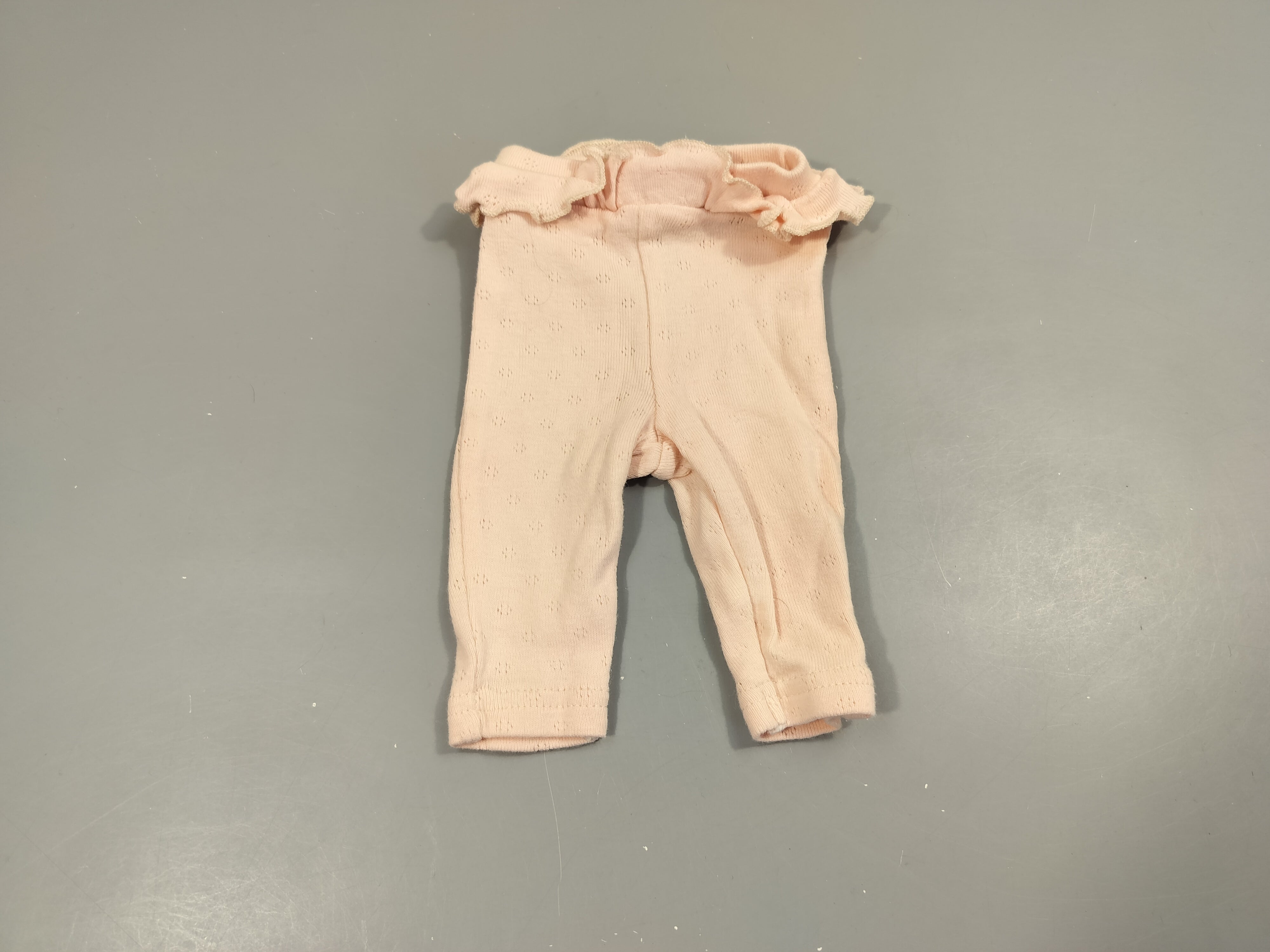 Legging rose clair , volant à la taille