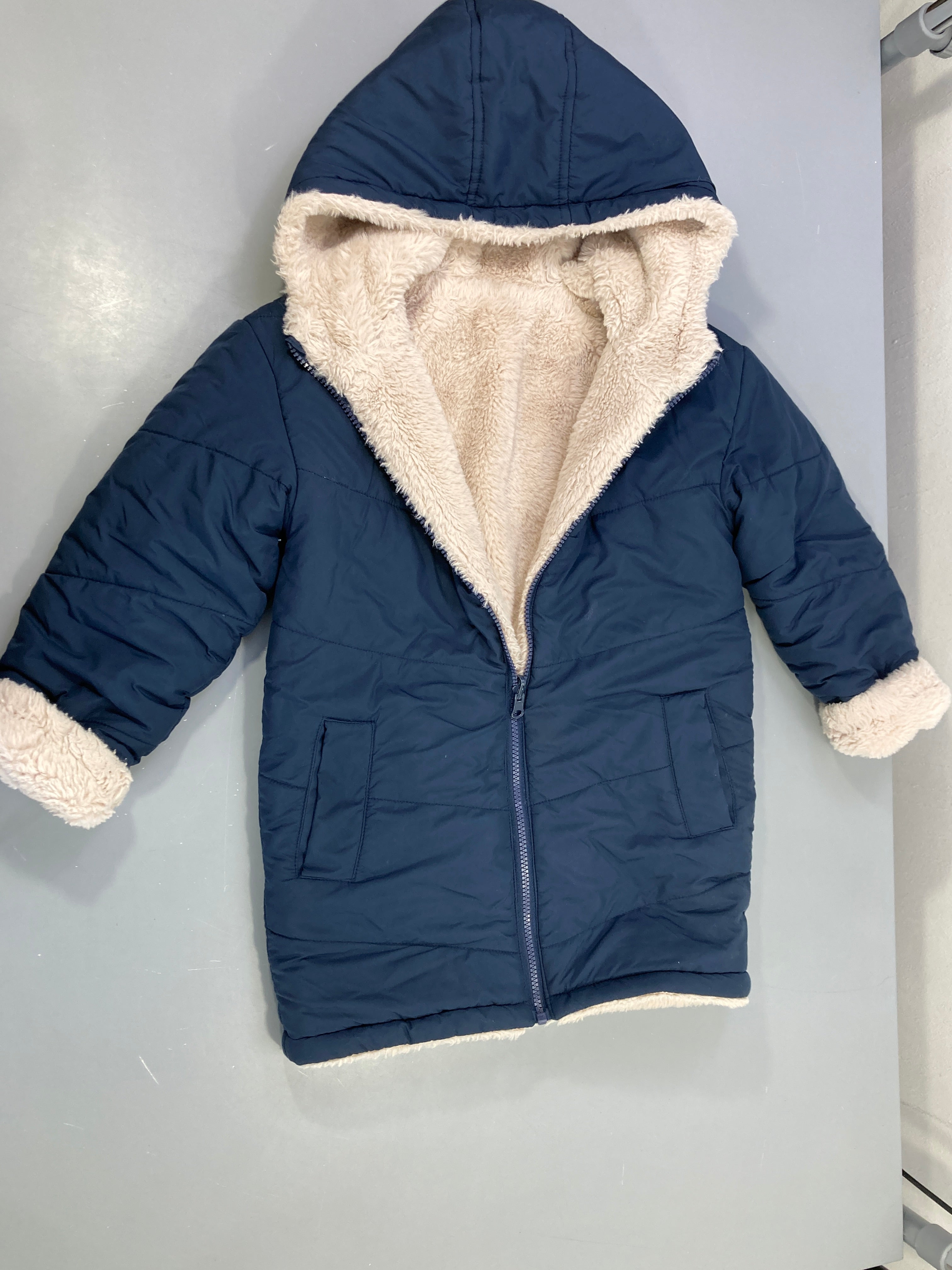 Doudoune réversible marine capuche peluche