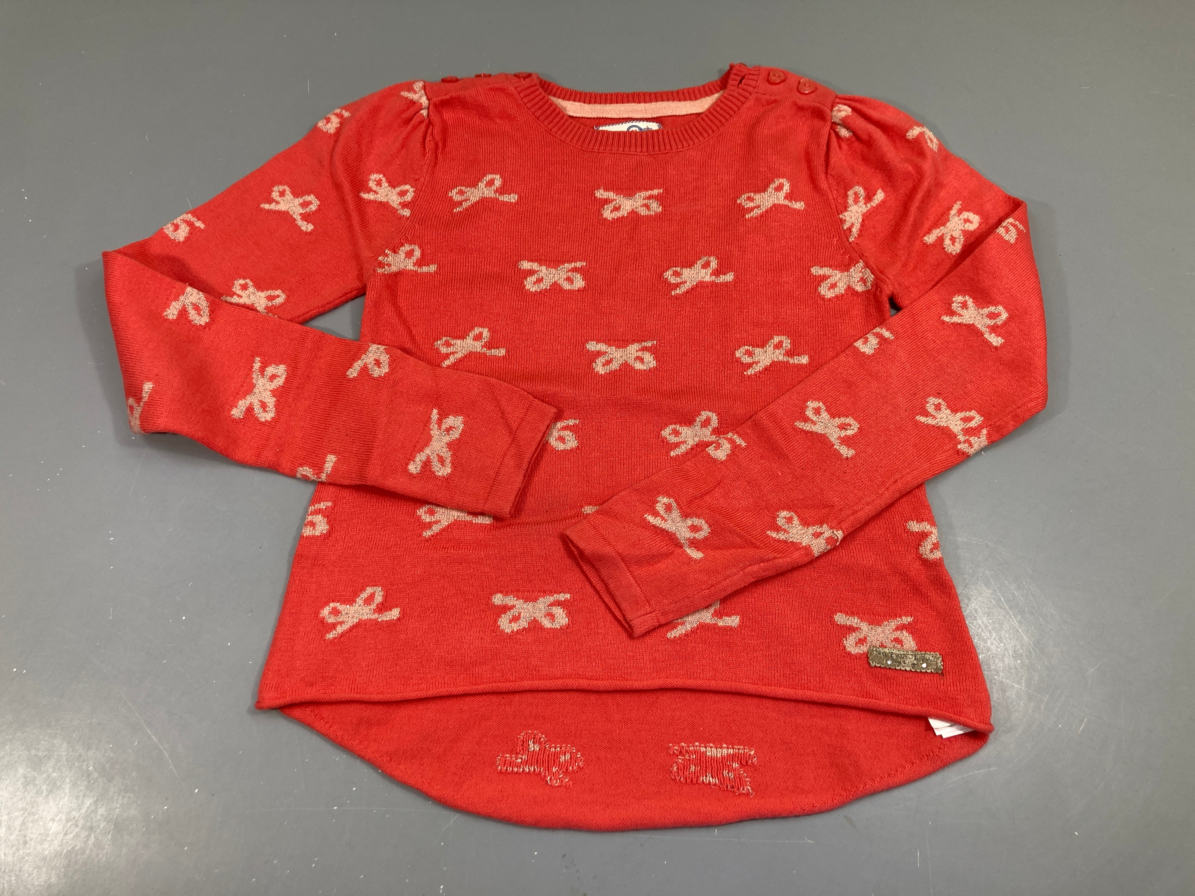 Pull orange avec noeuds dorés