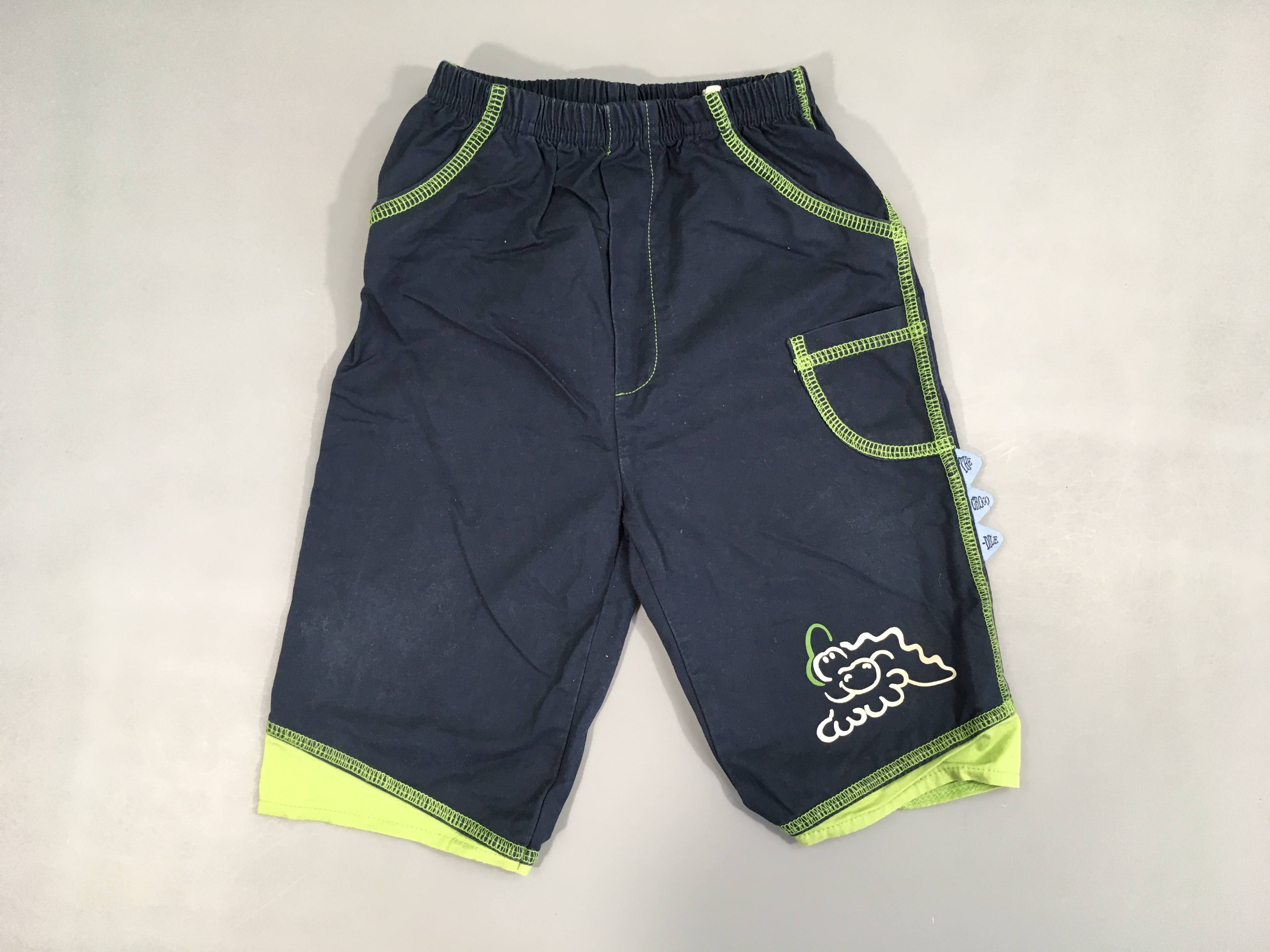 Pantalon bleu foncé surpiqures vertes crocodile