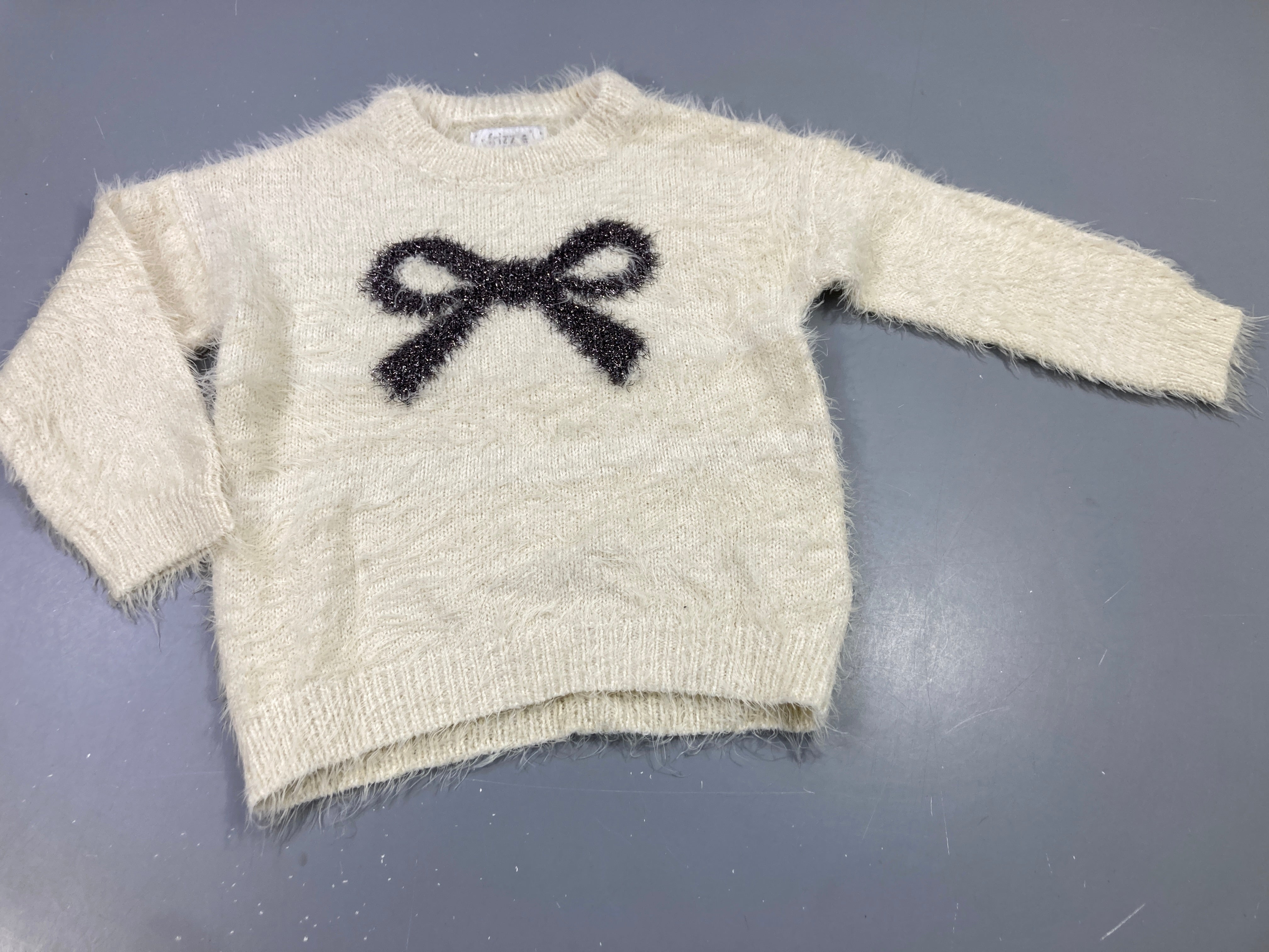 Pull peluche beige clairn noeud avec fils brillants