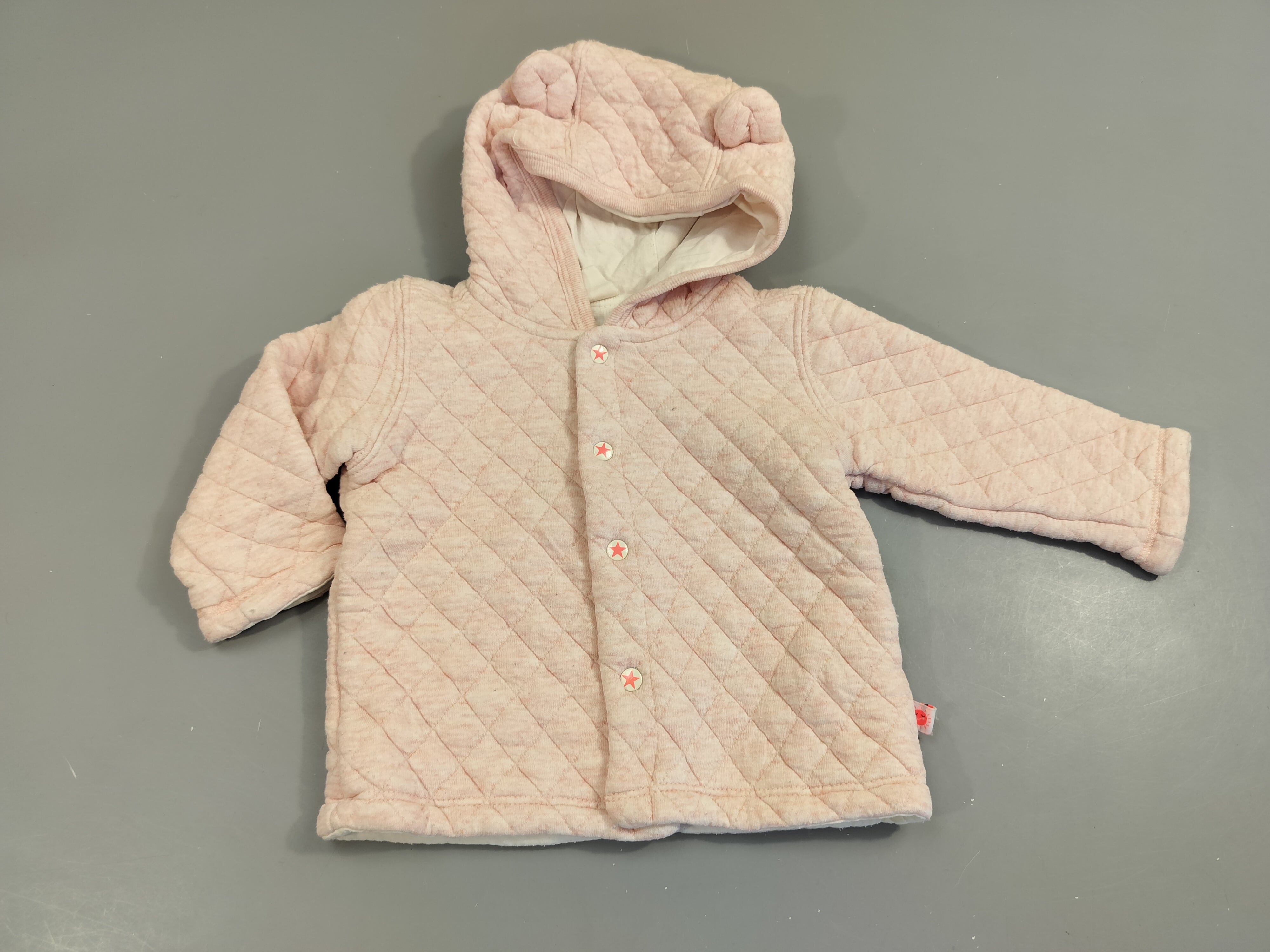 Gilet à capuche rose clair flammé matelassé ,légèrement bouloché 100% coton