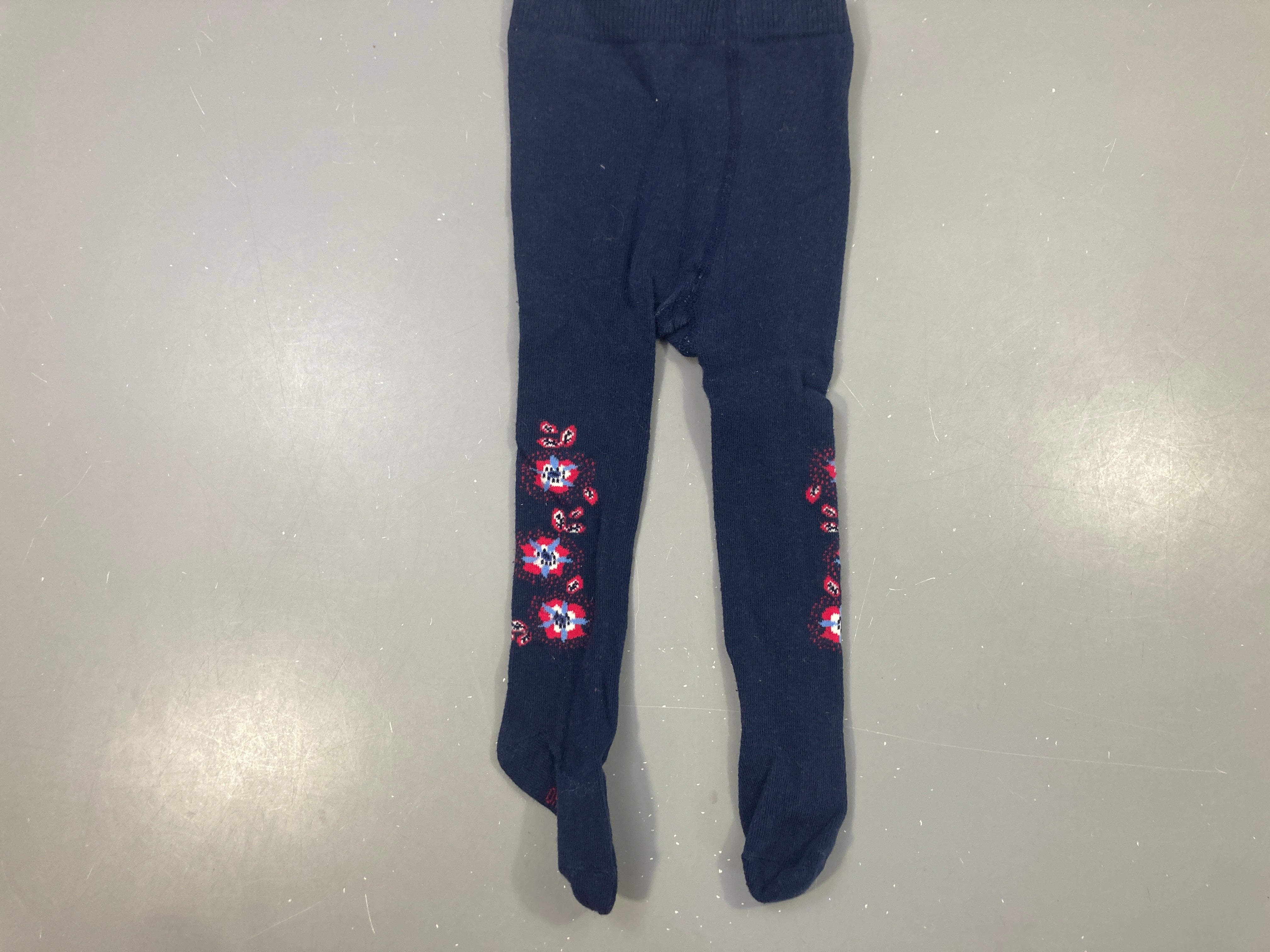 Collant marine motif fleurs rouges