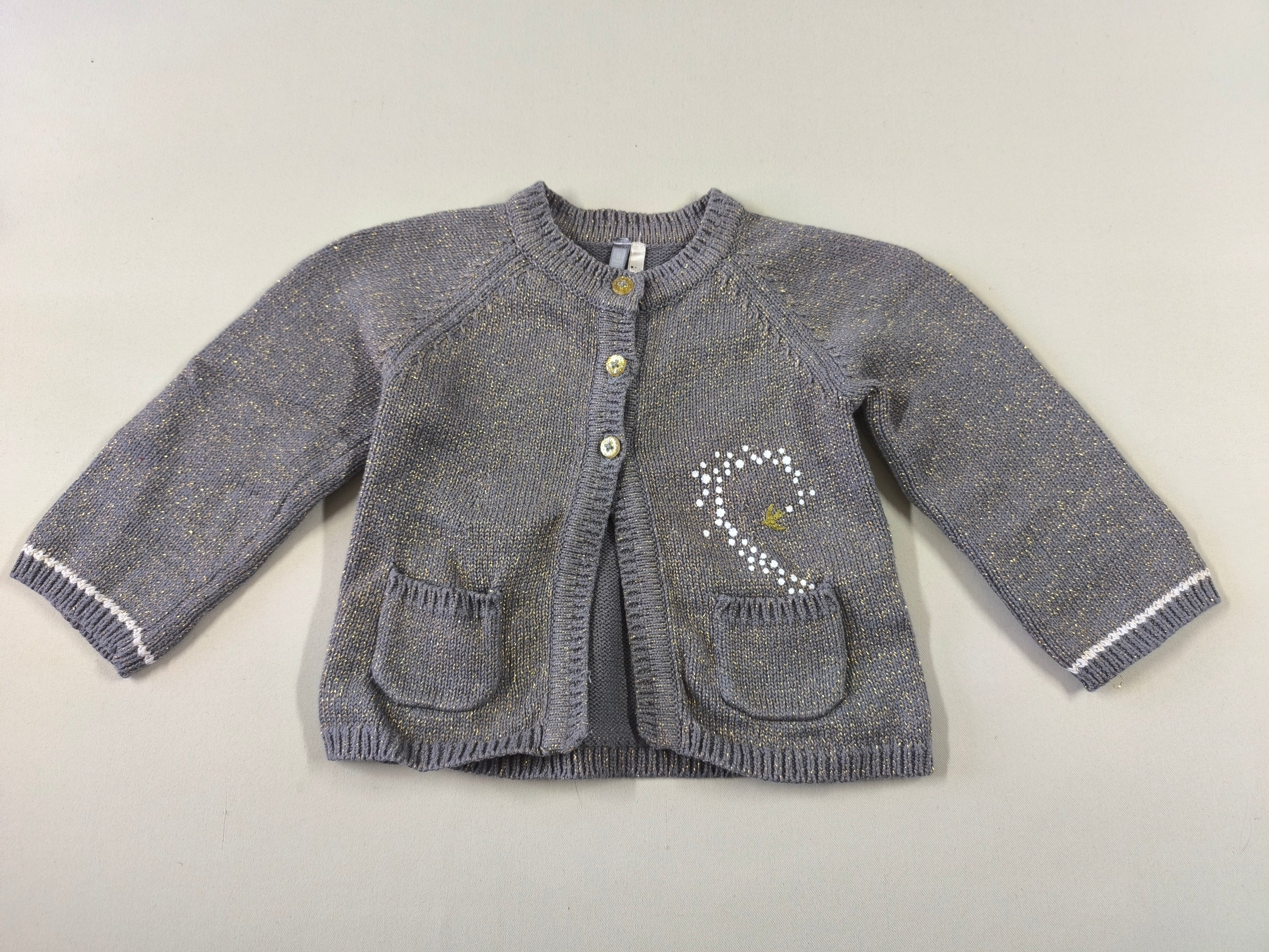 Gilet gris files dorés poches