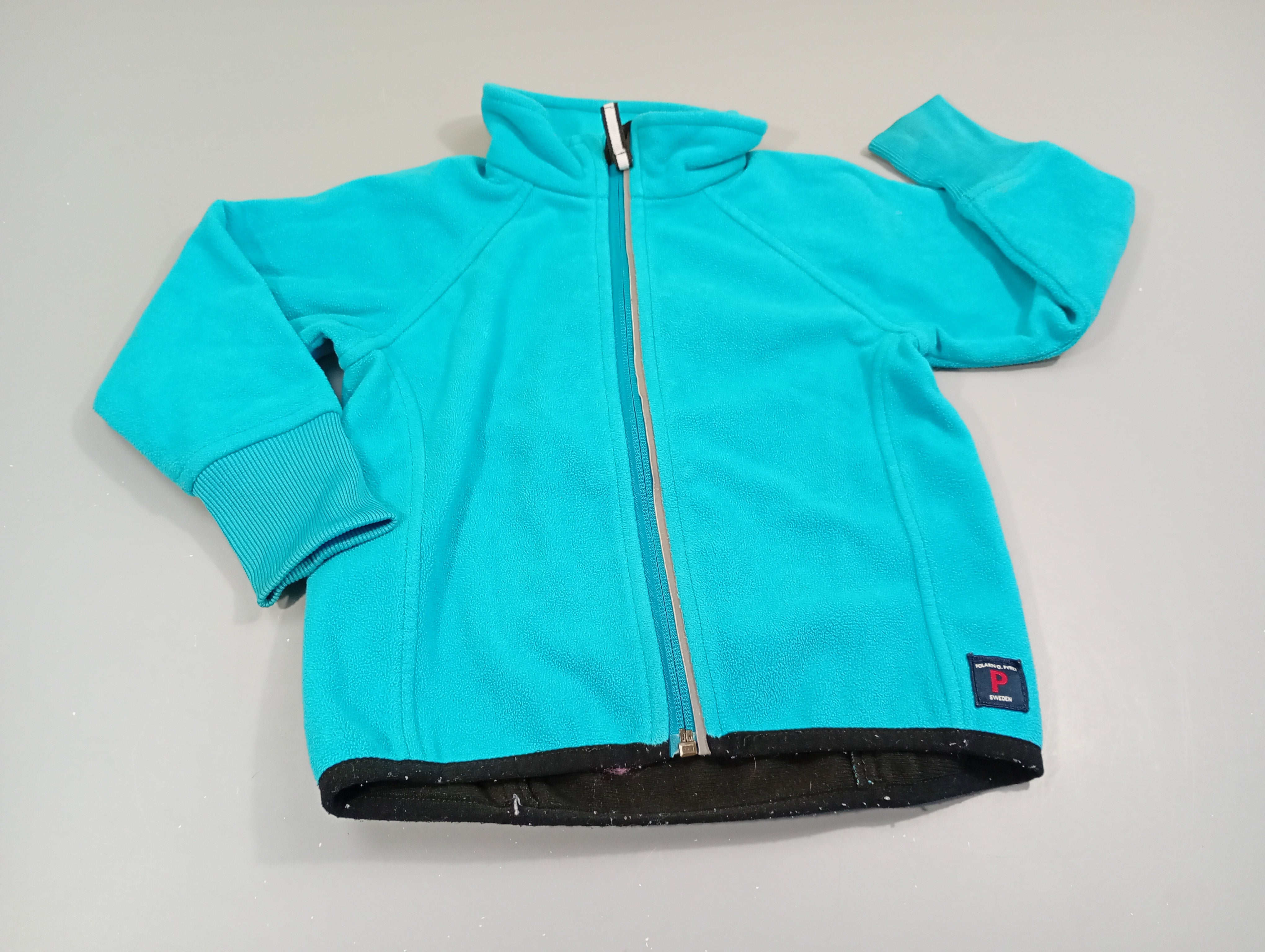 Polar zipé bleu turquoise  Polarn o. Pyret  Petite tache arrière manche droite