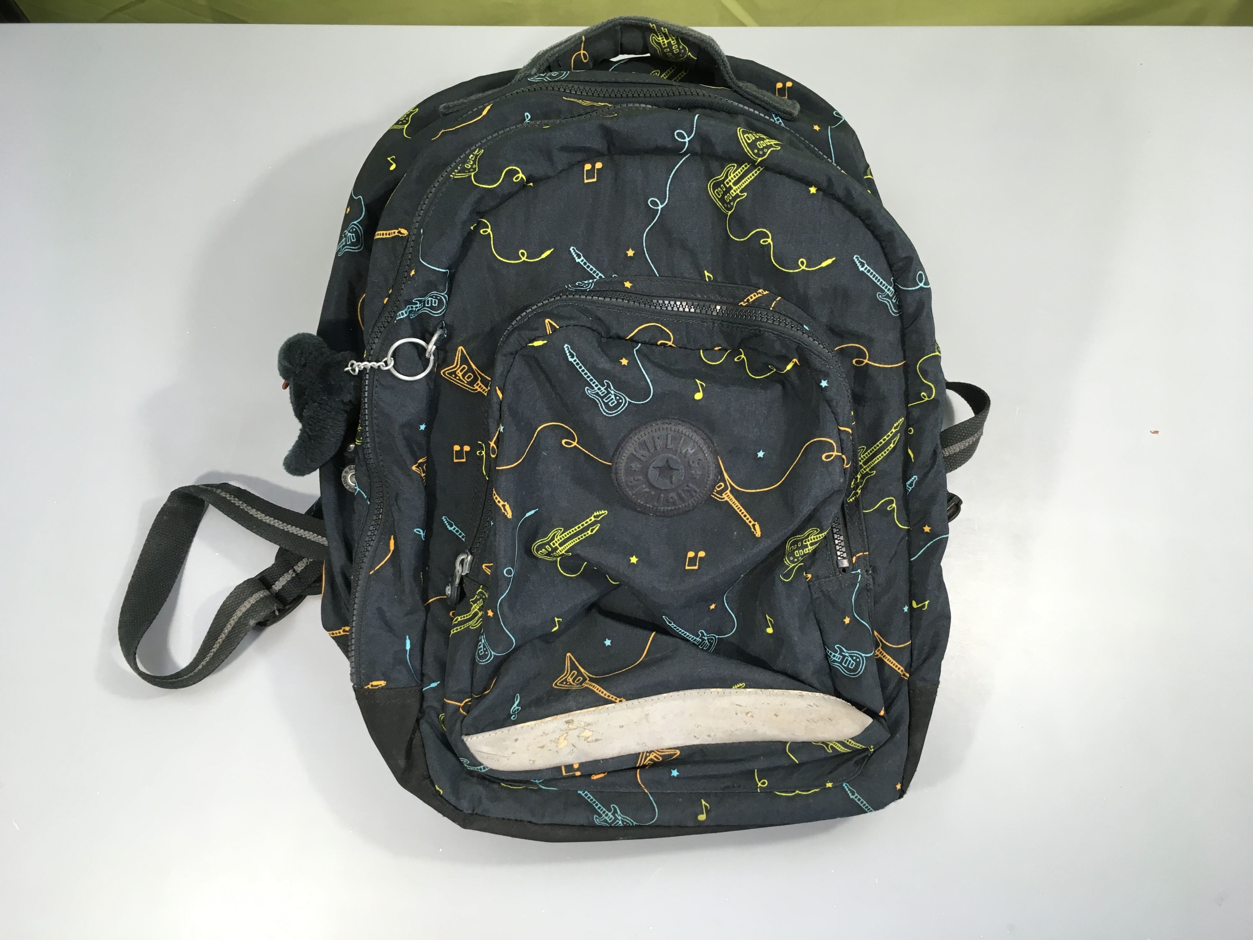 Sac à dos foncé guitares Kipling-Usure sur bande réfléchissante