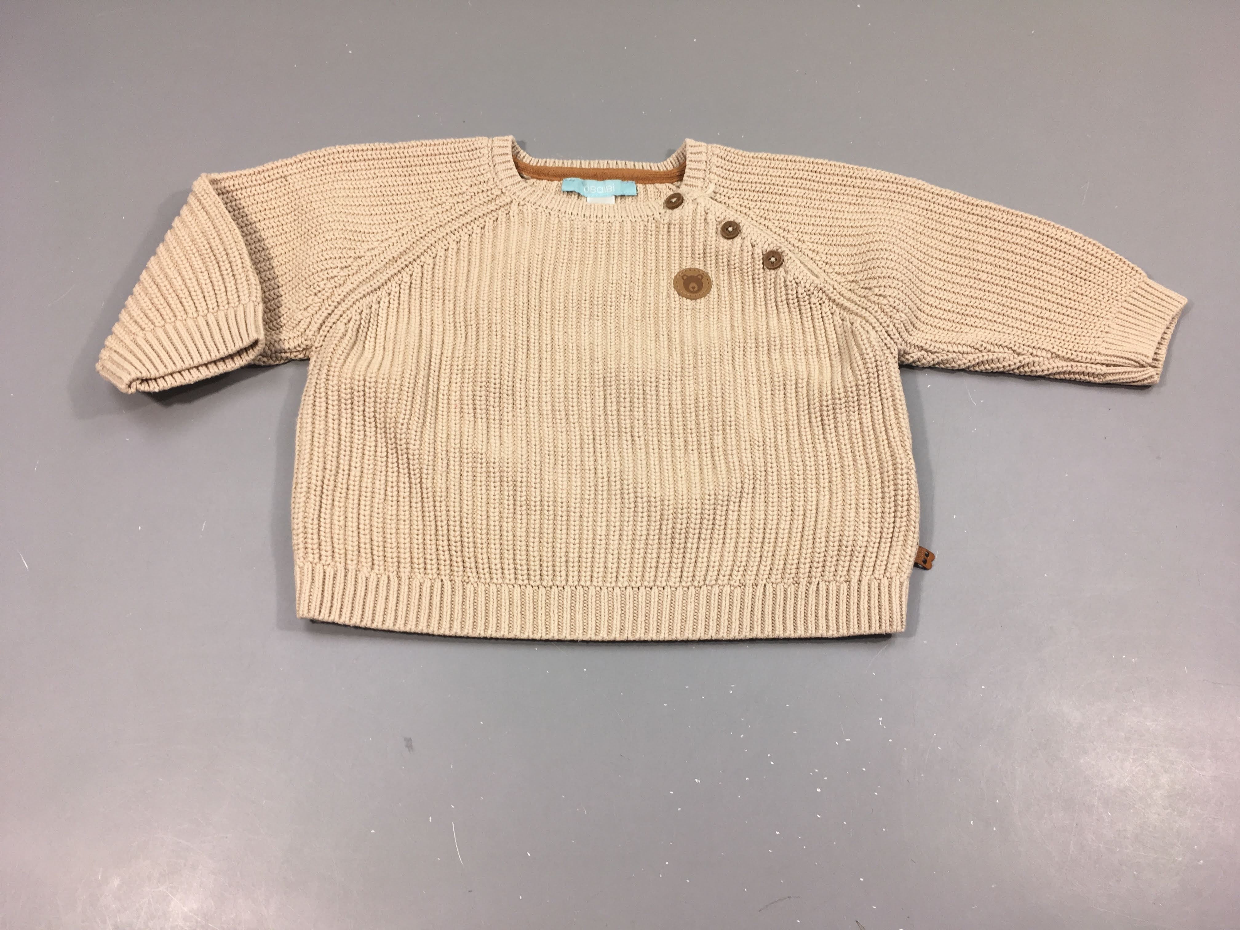 Pull en mailles beige, écusson ourson