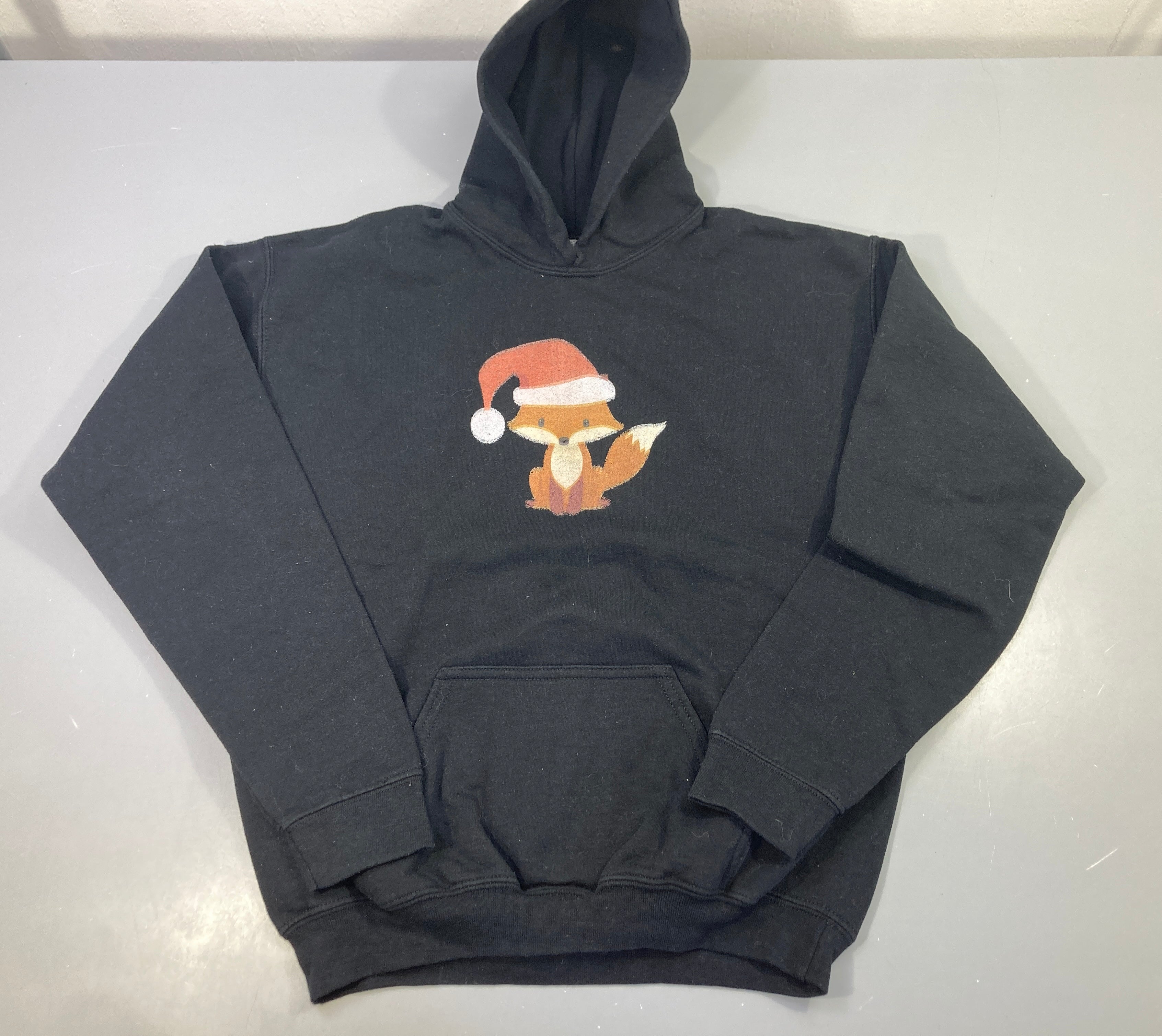 Sweat à capuche noir renard de noël-Bouloché
