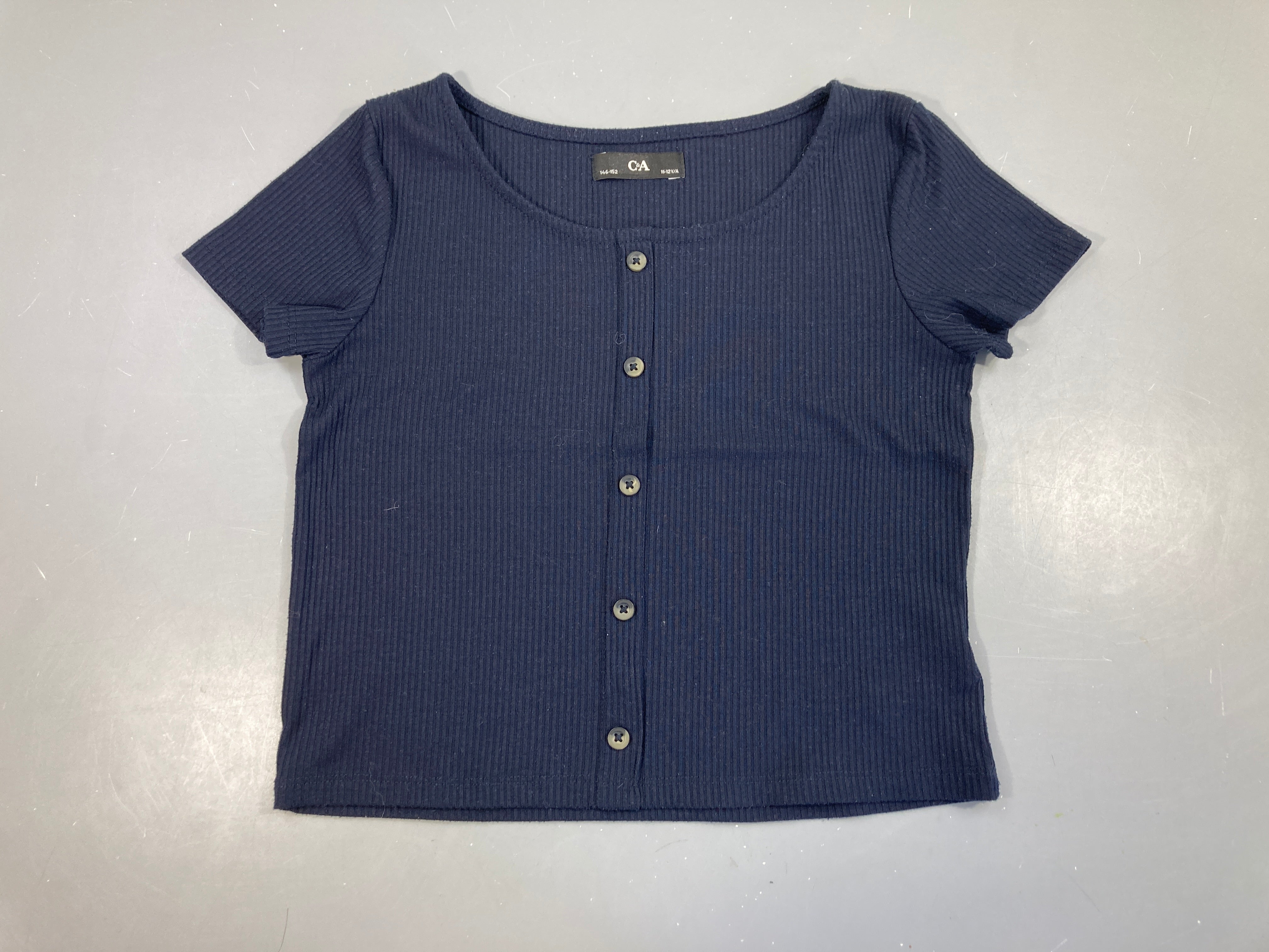 Blouse courte m.c molleton côtes bleu marine, légèrement boulochée
