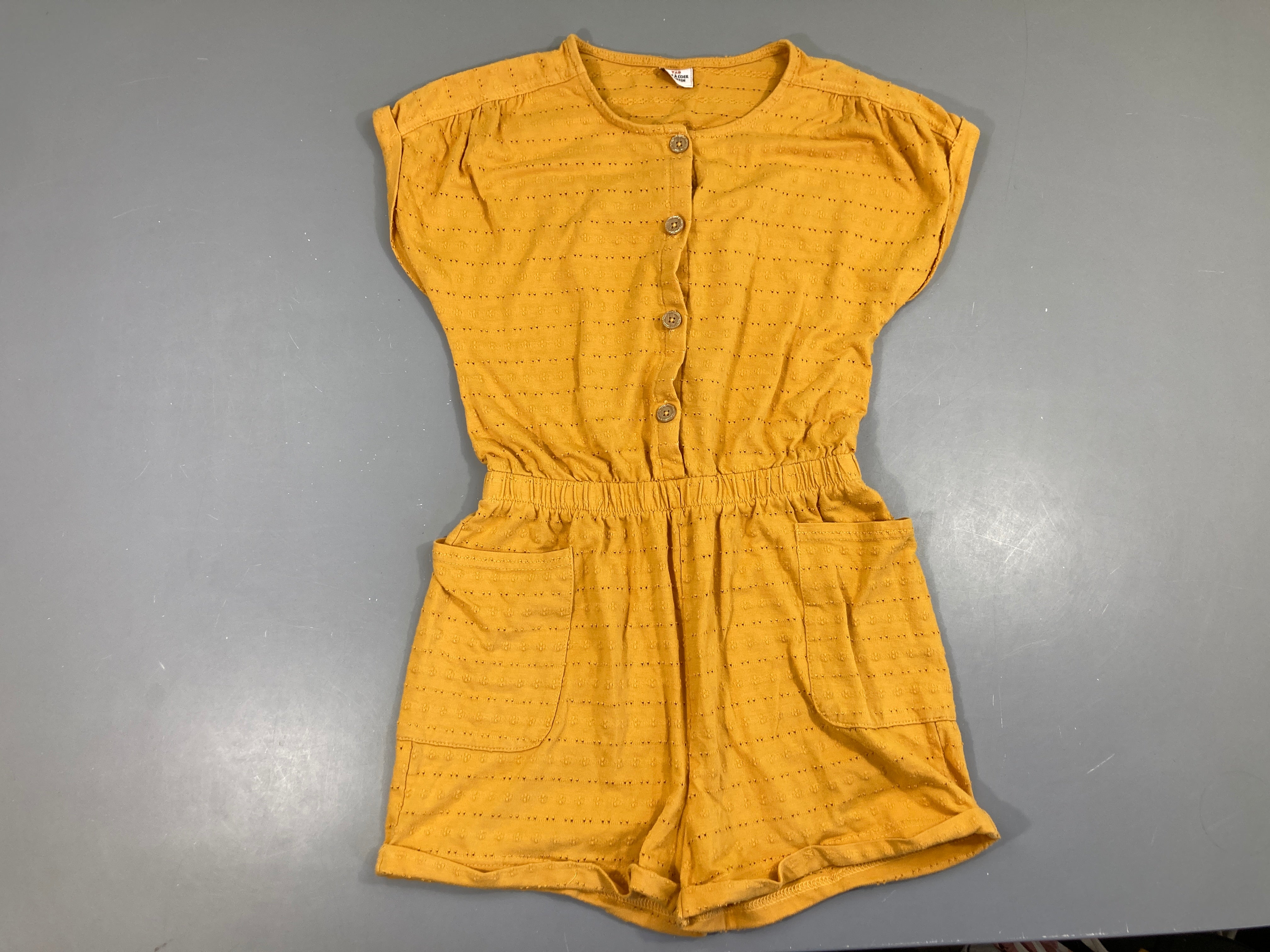 Combishort molleton orange ajouré, légèrement bouloché