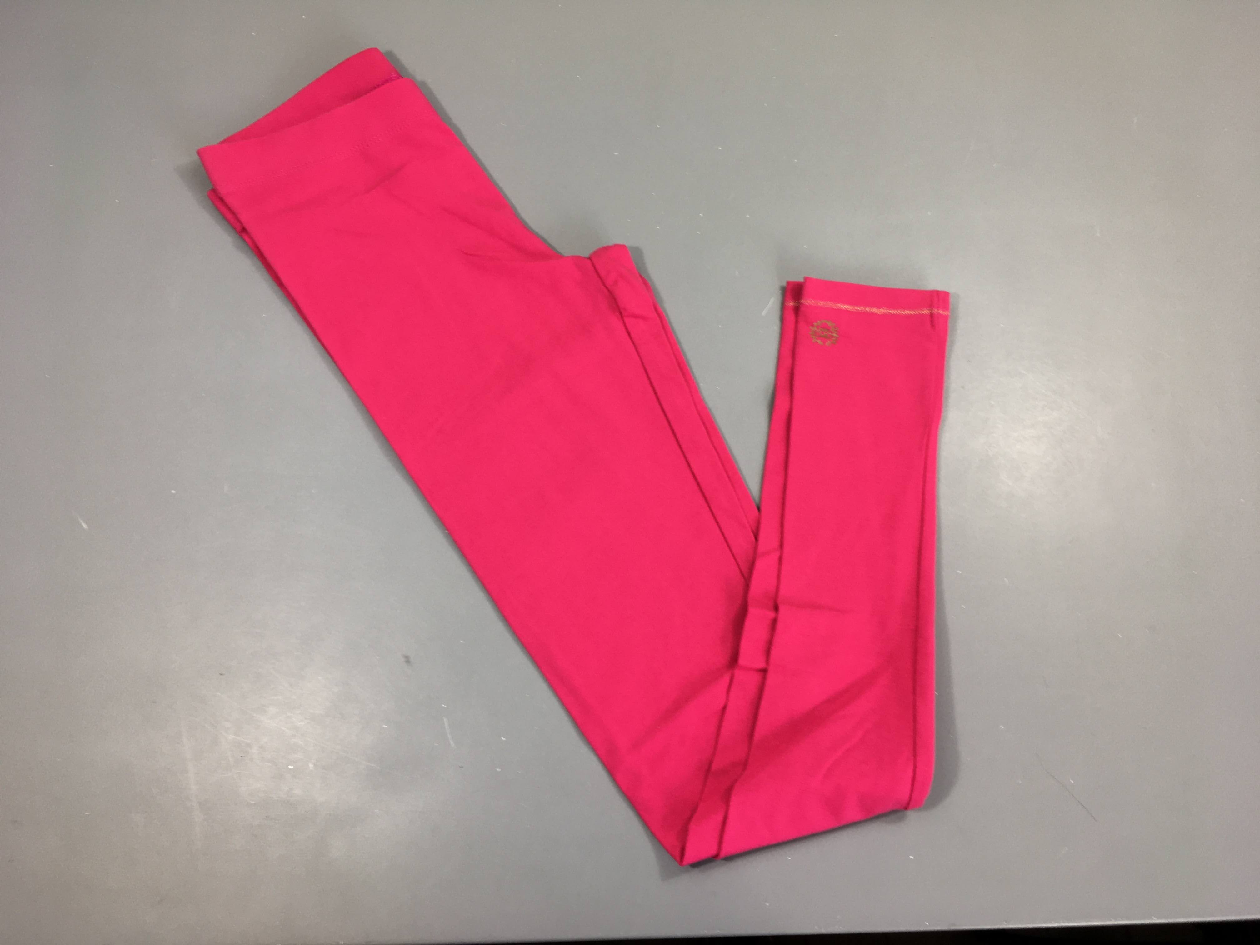 Legging rose, légèrement bouloché