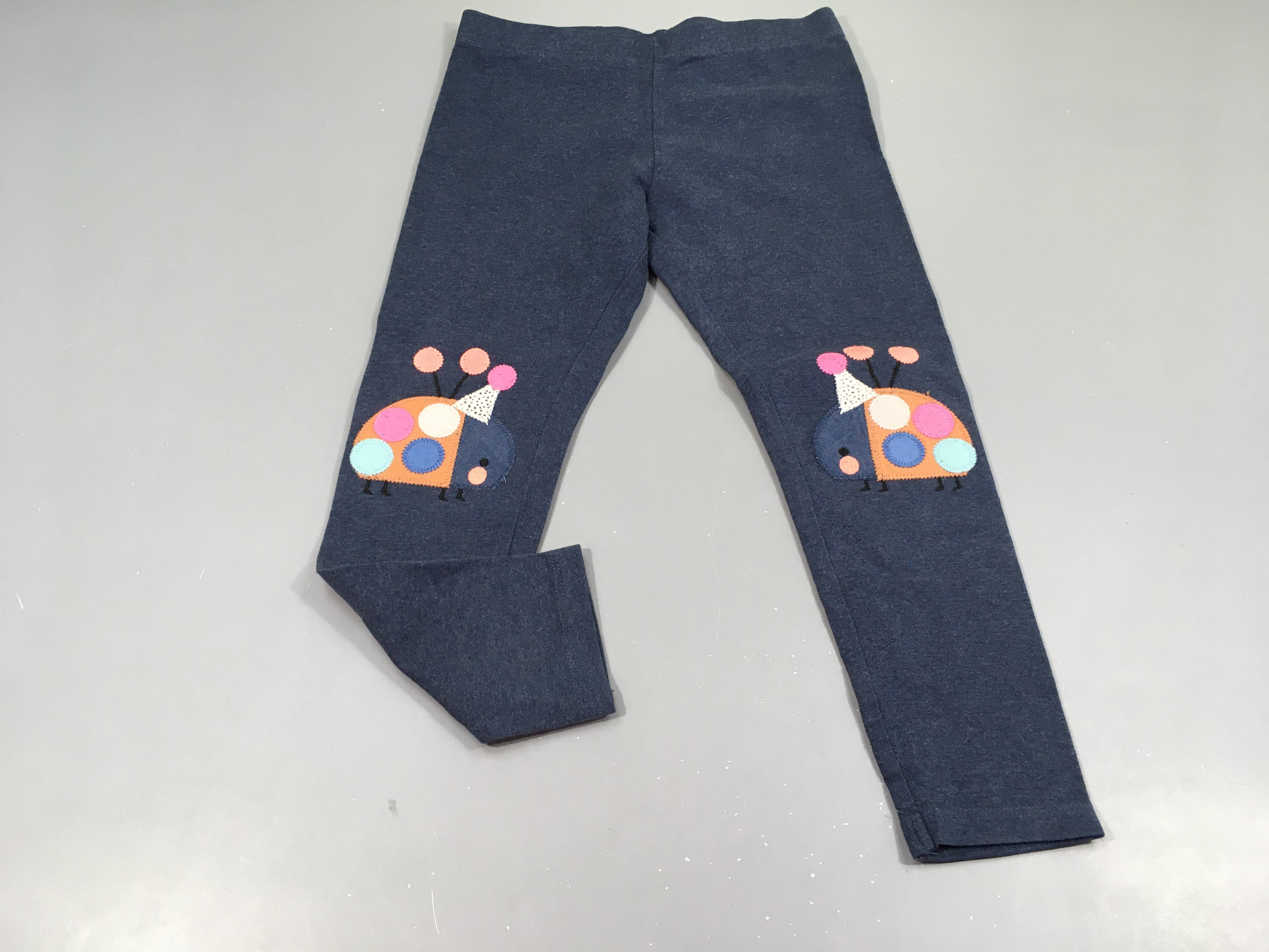 Legging bleu chiné, coccinelles aux genoux