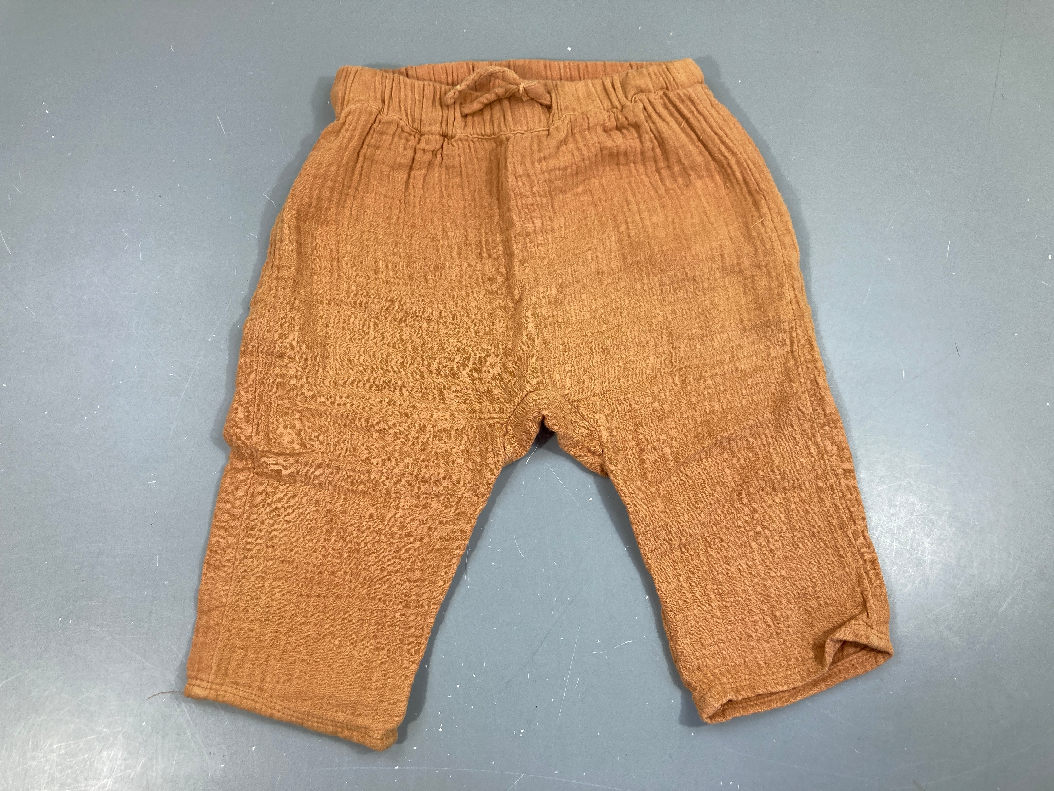 Pantalon gaze de coton orange légèrement bouloché