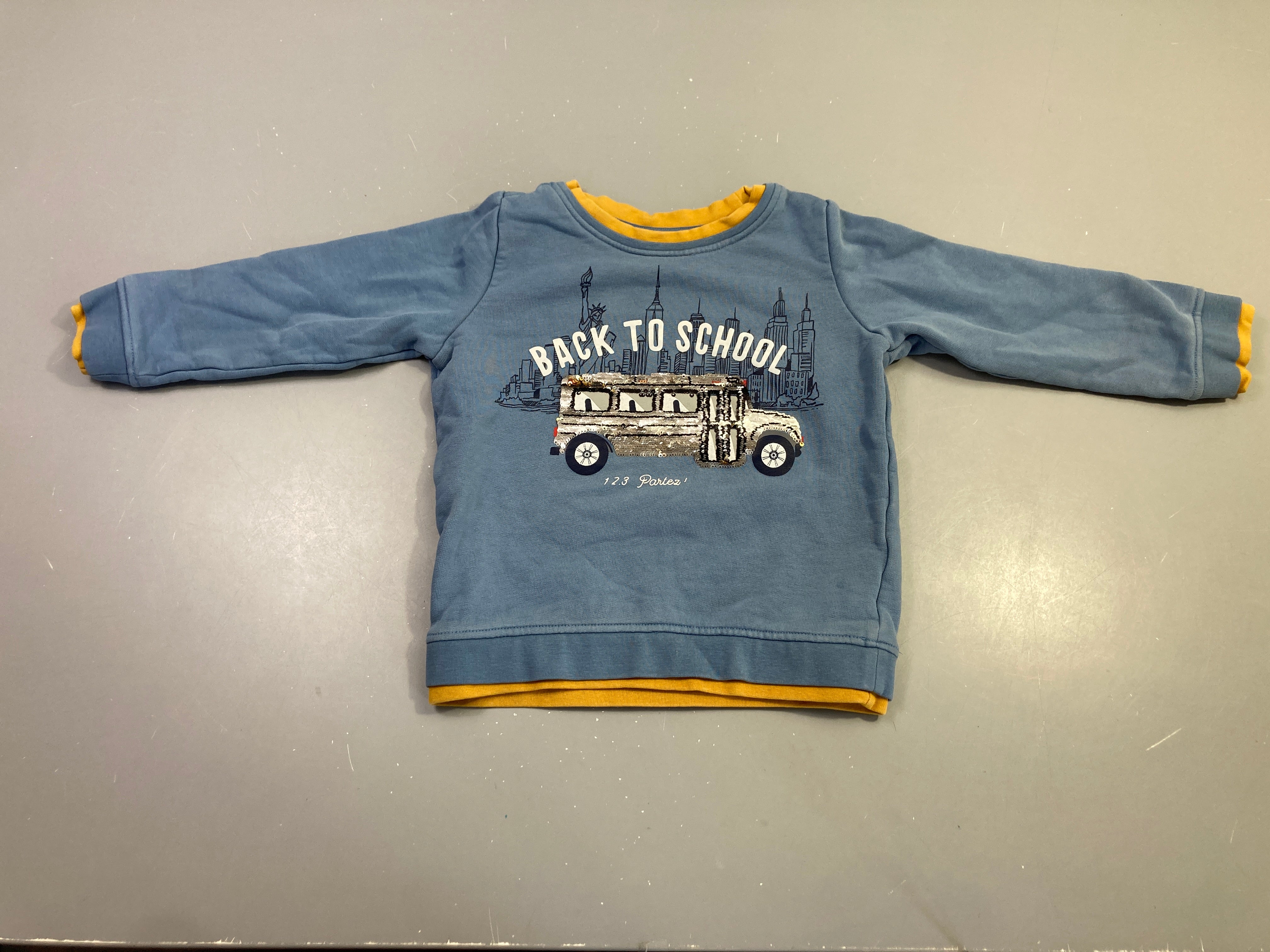 Sweat effet superposé moutarde bleu bus sequins back to school