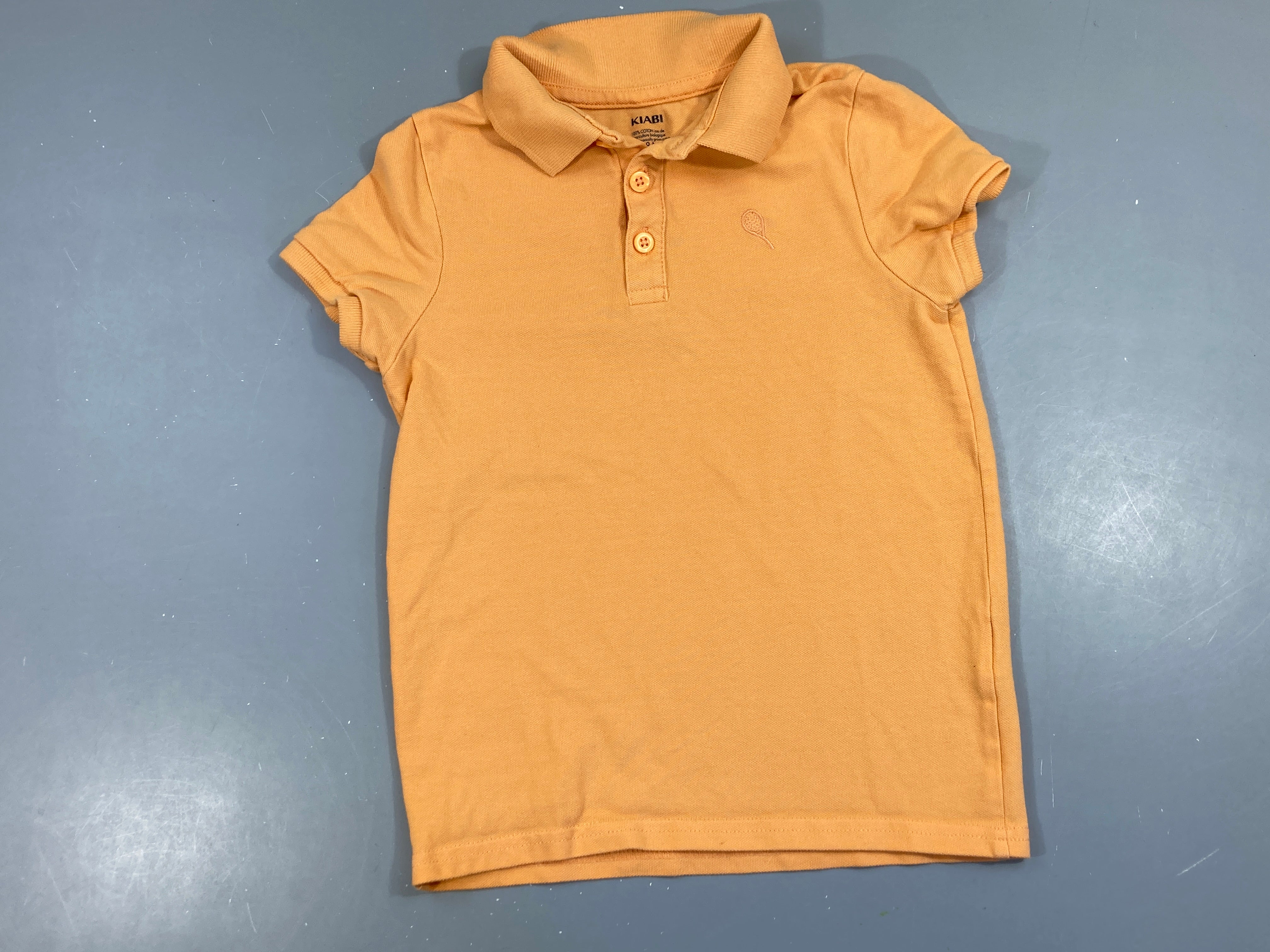 Polo m.c orange raquette