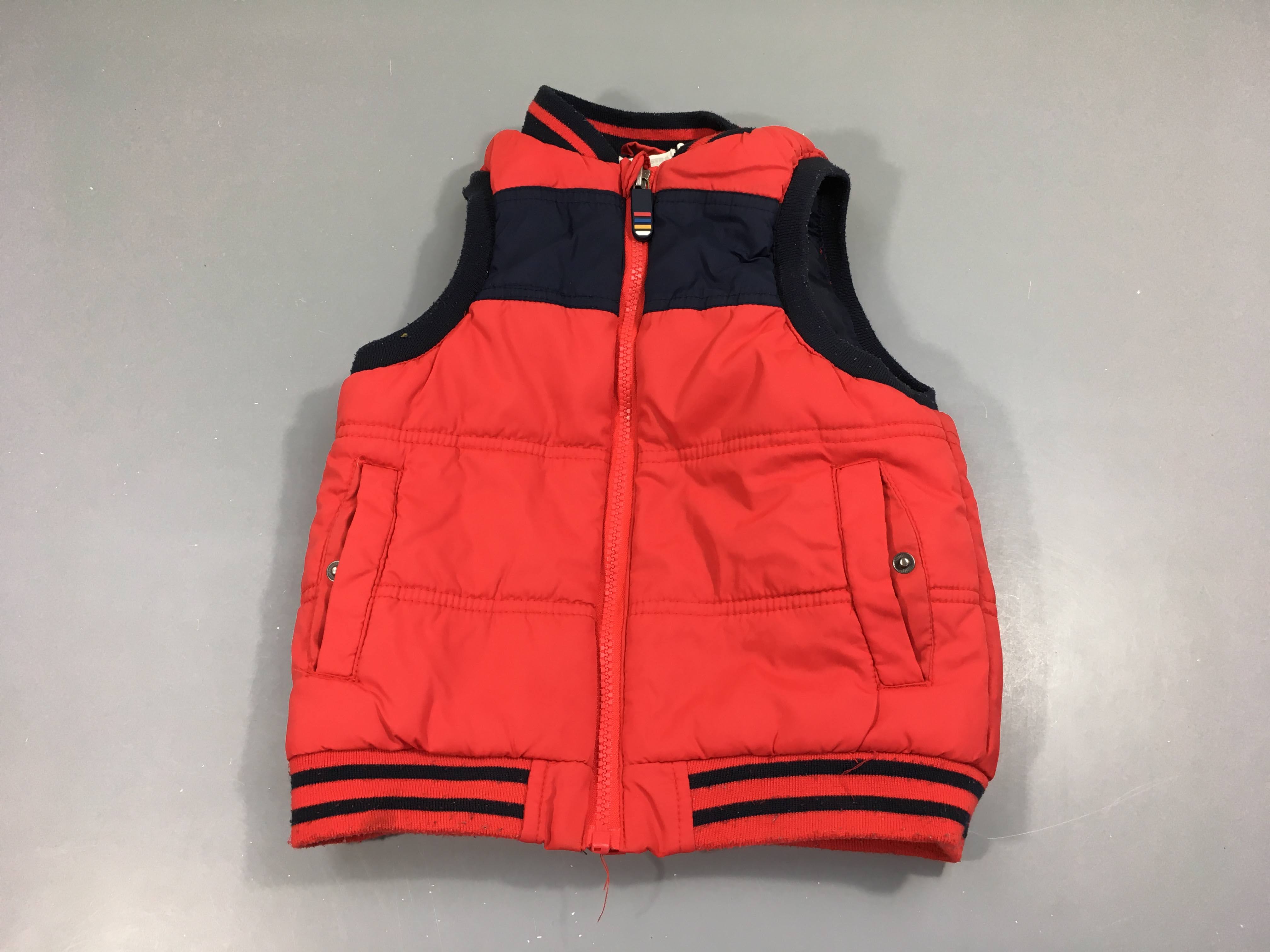 Bodywarmer rouge/bleu foncé, légèrement bouloché
