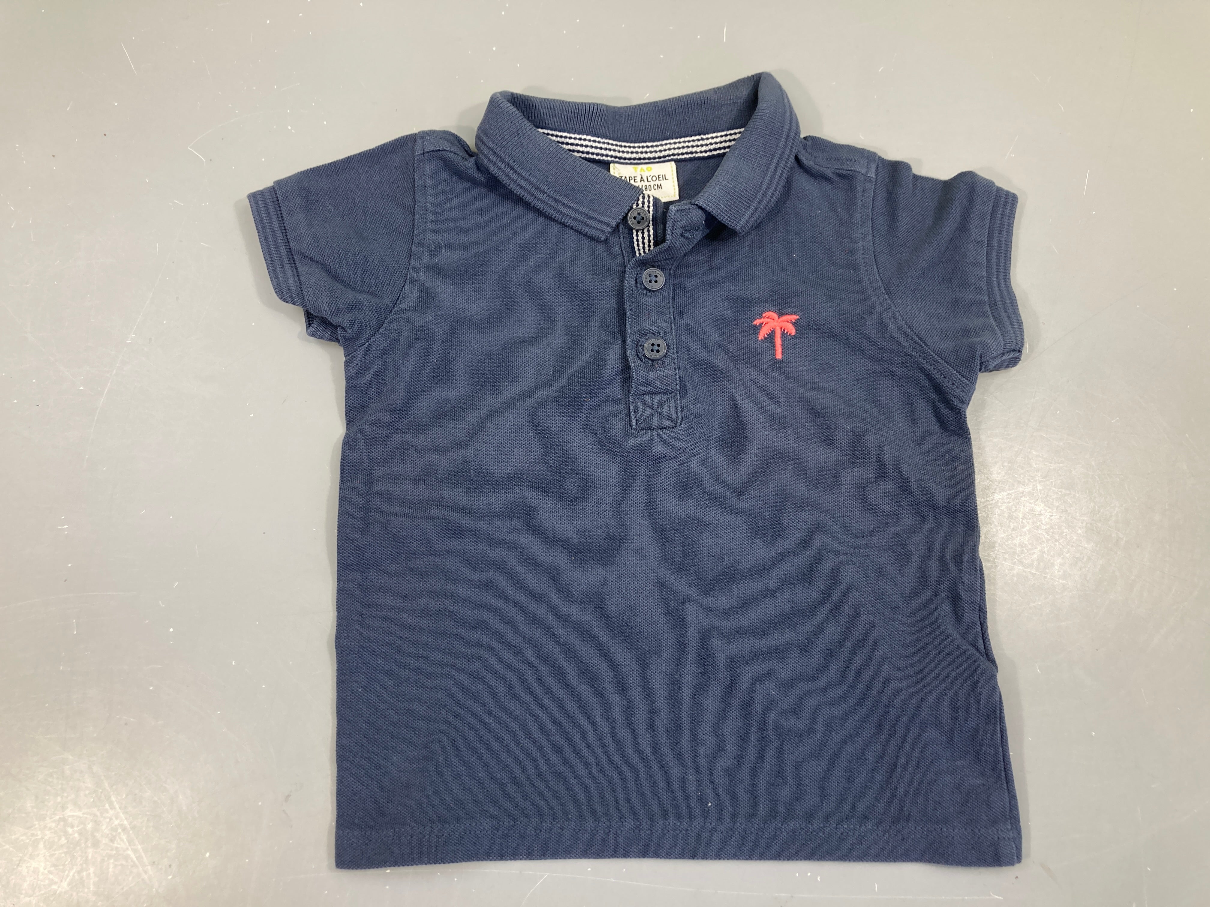 Polo m.c bleu marine palmier