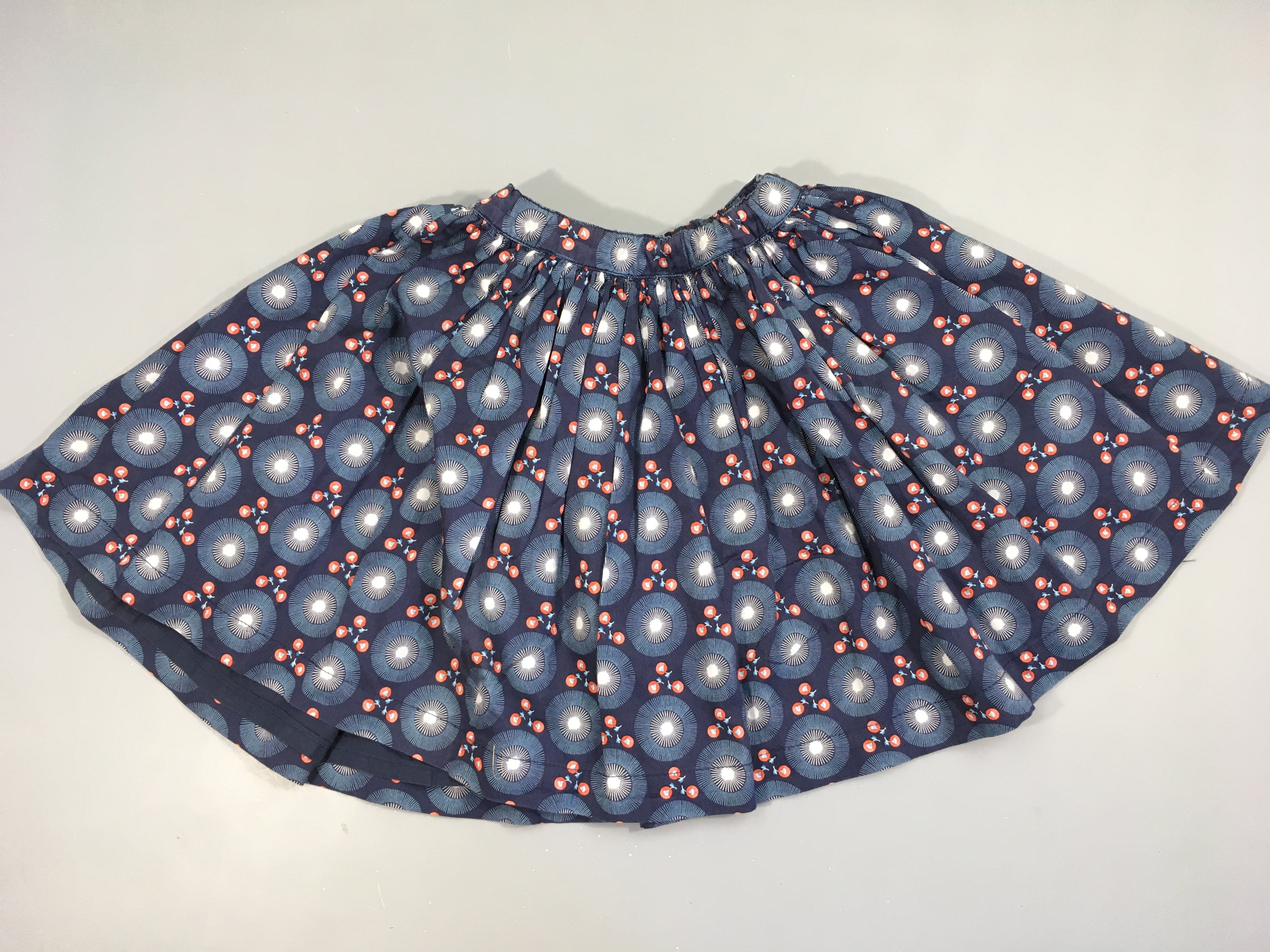 Jupe bleu foncé cercles fleurs