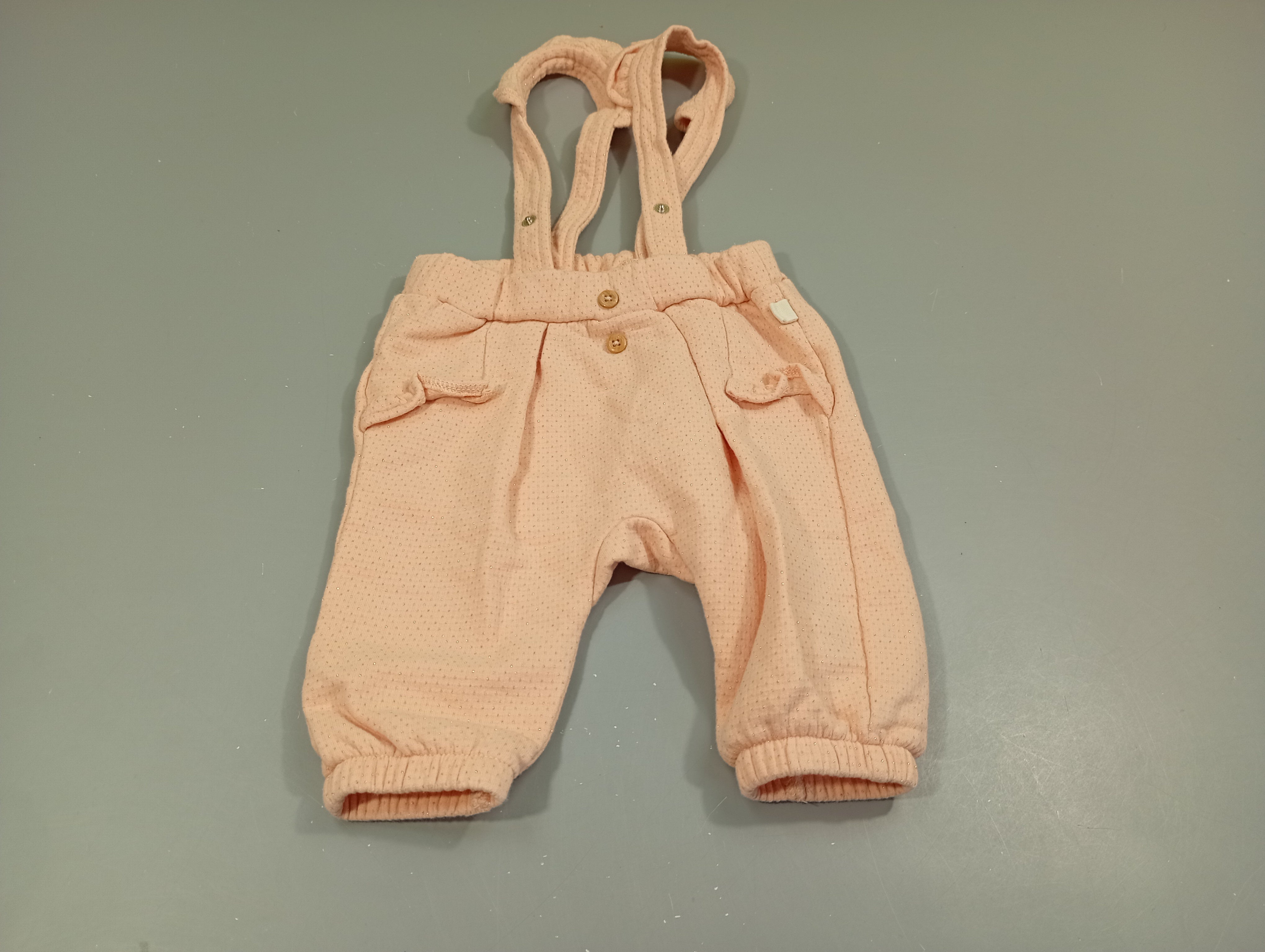 Salopette rose clair à pois paillelés